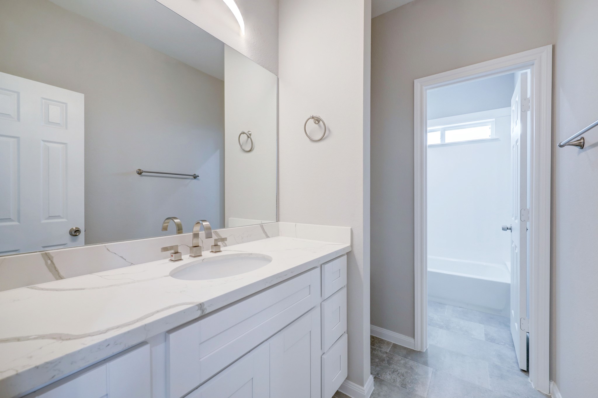 The second-floor secondary bath with separate shower space doesn't feel secondary at all! Picture is of the model home. - If you have additional questions regarding 8106 James Franklin Street  in Houston or would like to tour the property with us call 800-660-1022 and reference MLS# 70741946.