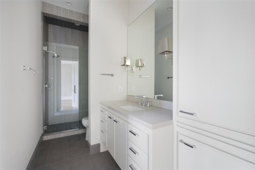 This secondary bath features a frameless walk-in shower, sleek cabinetry with quartz countertops and built-ins, and polished chrome Brizo fixtures. All secondary baths are outfitted with custom Spanish and Italian tile. - If you have additional questions regarding 2514 Avalon Place  in Houston or would like to tour the property with us call 800-660-1022 and reference MLS# 13685198.