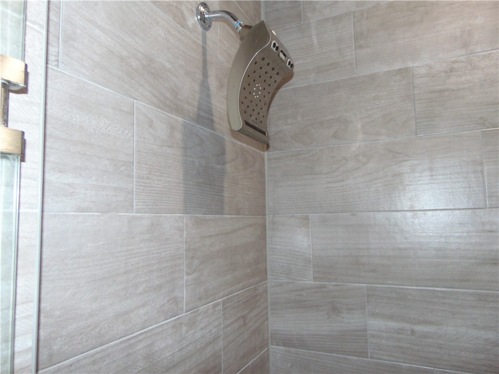 Master Shower - If you have additional questions regarding 1113 E Kenedy Avenue  in Kingsville or would like to tour the property with us call 800-660-1022 and reference MLS# 404636.
