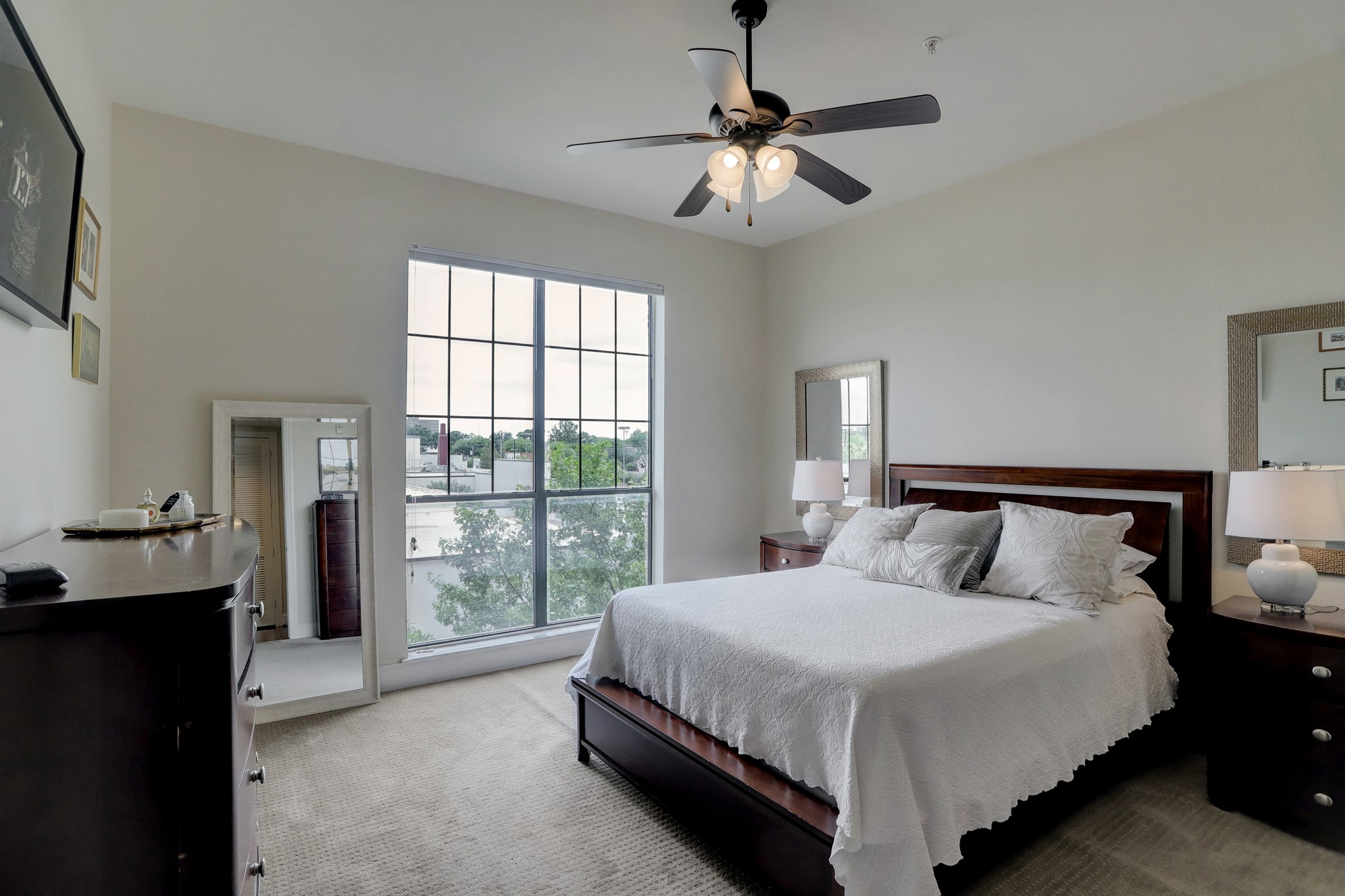 The owner's suite impresses with an expansive layout, southern light and a ceiling fan. - If you have additional questions regarding 2120 Kipling Street  in Houston or would like to tour the property with us call 800-660-1022 and reference MLS# 20665105.