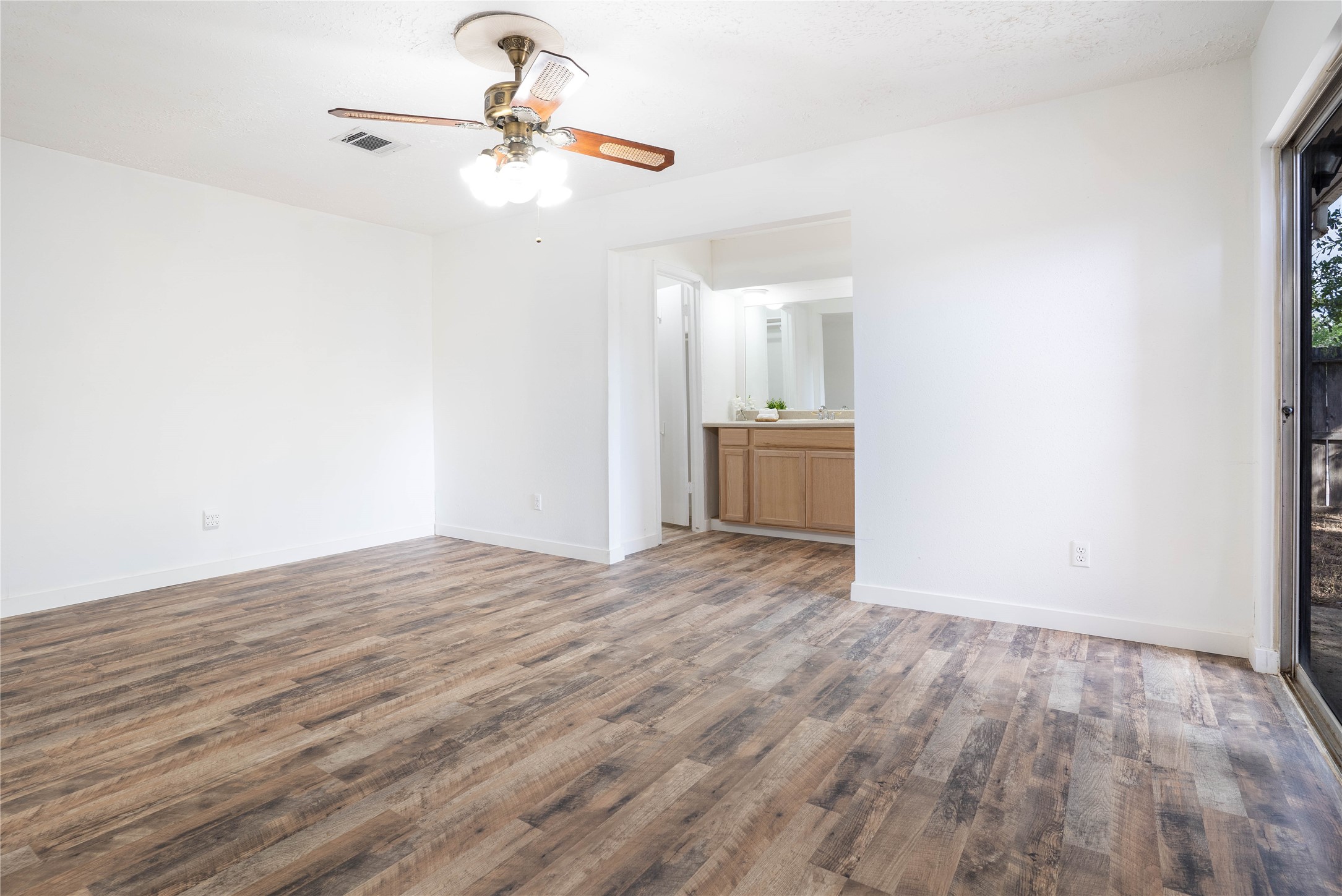 Primary bedroom features a walk-in closet to the left and tub/shower combination to the right. - If you have additional questions regarding 10218 Golden Sunshine Drive  in Houston or would like to tour the property with us call 800-660-1022 and reference MLS# 5796126.