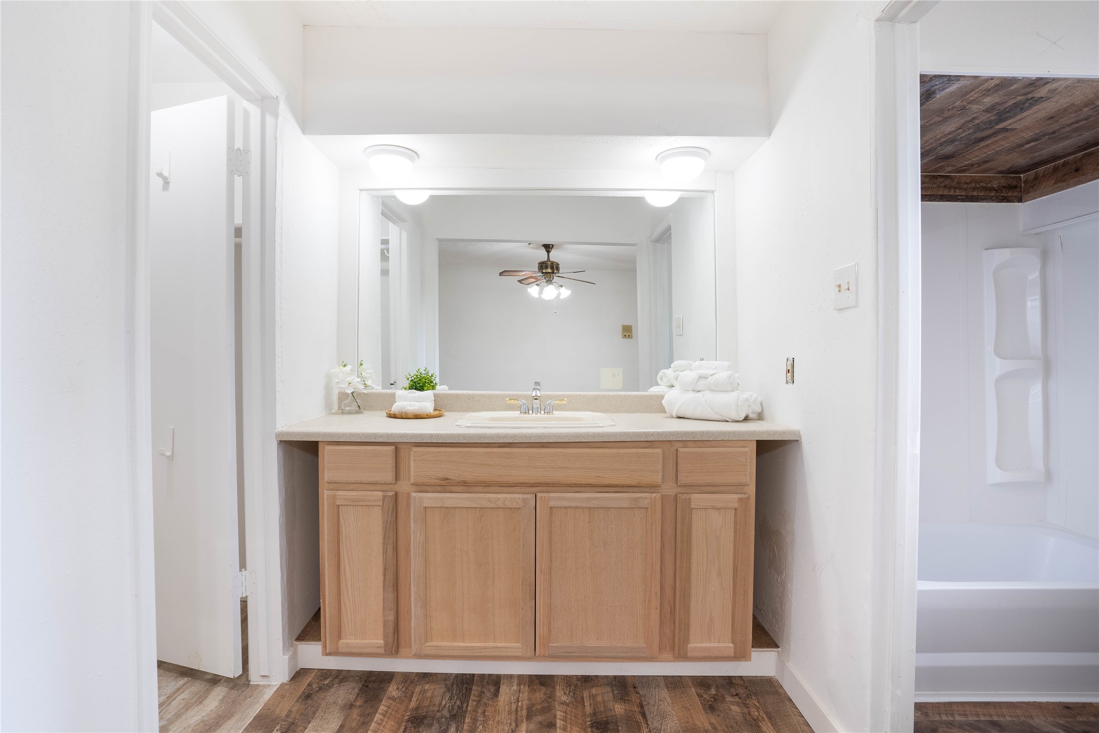 New restroom vanity. Walk-in closet to the left and ensuite bath to the right. - If you have additional questions regarding 10218 Golden Sunshine Drive  in Houston or would like to tour the property with us call 800-660-1022 and reference MLS# 5796126.