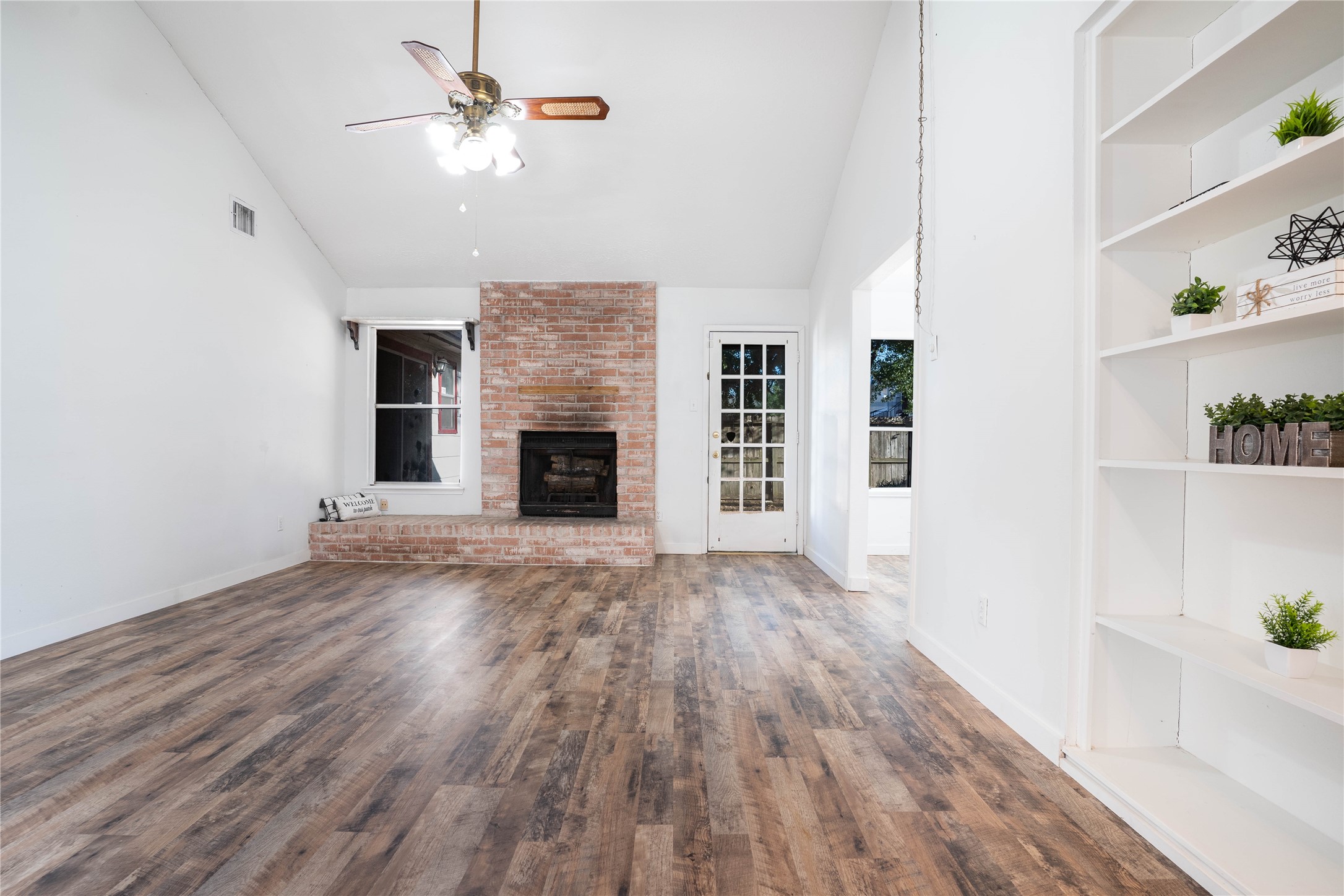 Enter into your large living room with large windows, new laminate flooring and wood-burning fireplace! - If you have additional questions regarding 10218 Golden Sunshine Drive  in Houston or would like to tour the property with us call 800-660-1022 and reference MLS# 5796126.