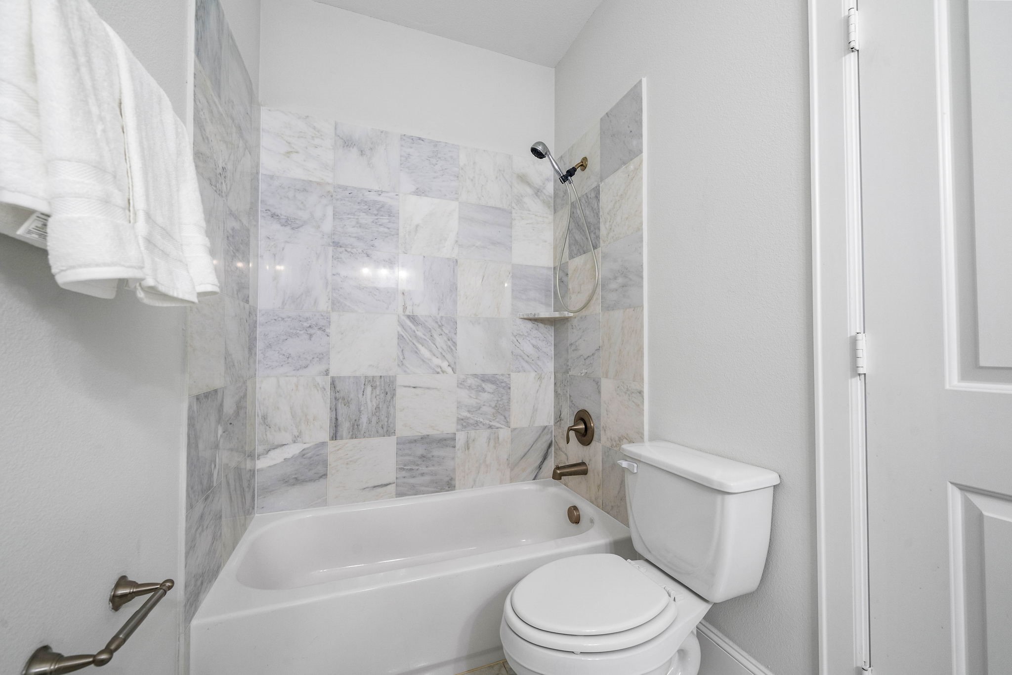walk-in bathroom with a bath tub/shower combo. - If you have additional questions regarding 2433 Dorrington Street  in Houston or would like to tour the property with us call 800-660-1022 and reference MLS# 30508451.