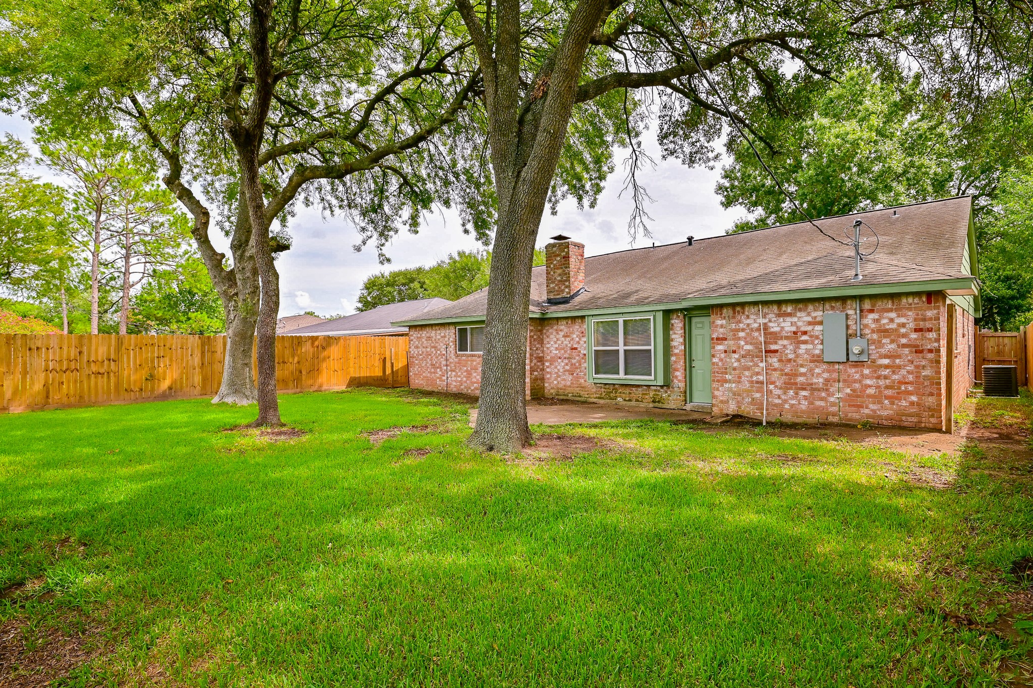 The backyard is spacious, with large trees and recent fencing. - If you have additional questions regarding 11510 W Bellfort Avenue  in Houston or would like to tour the property with us call 800-660-1022 and reference MLS# 2873189.