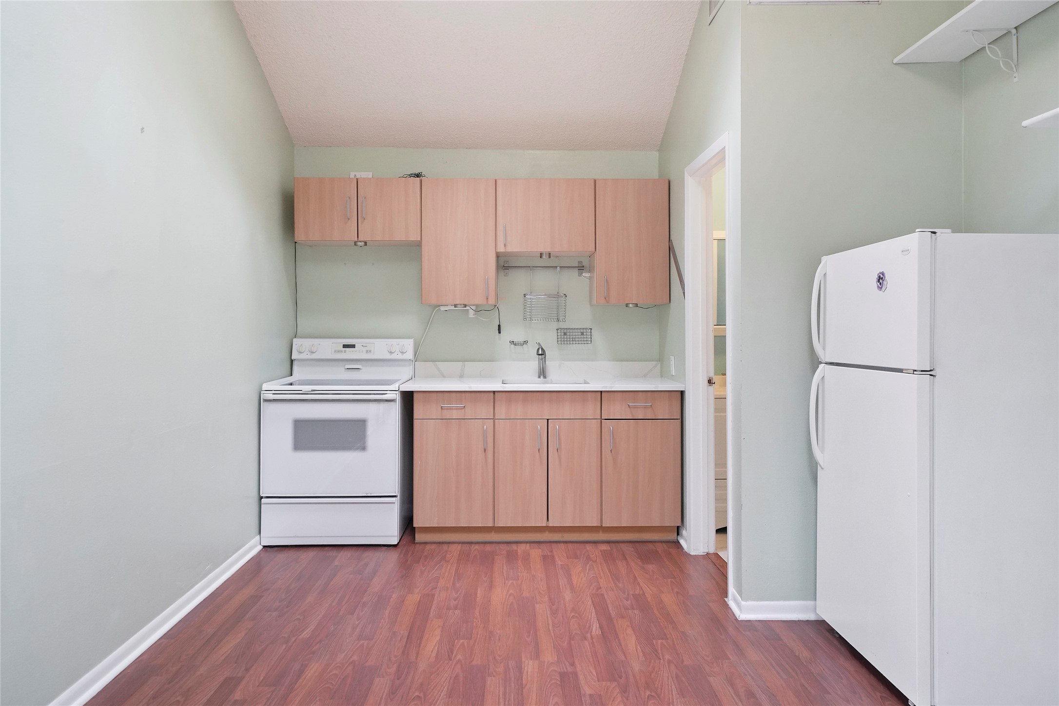 Apartment kitchen with storage, range, sink and refrigerator. - If you have additional questions regarding 1118 Peddie Street  in Houston or would like to tour the property with us call 800-660-1022 and reference MLS# 17025170.
