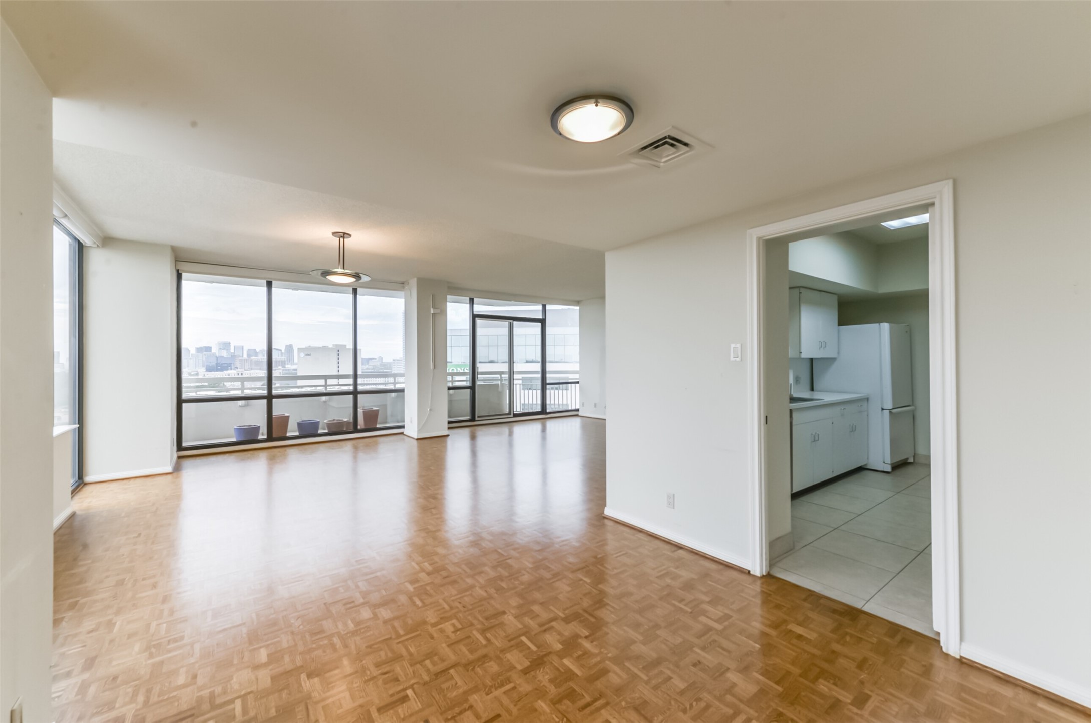 The living area wraps around providing corner views and access to the kitchen. - If you have additional questions regarding 14 Greenway Plaza  in Houston or would like to tour the property with us call 800-660-1022 and reference MLS# 26451519.