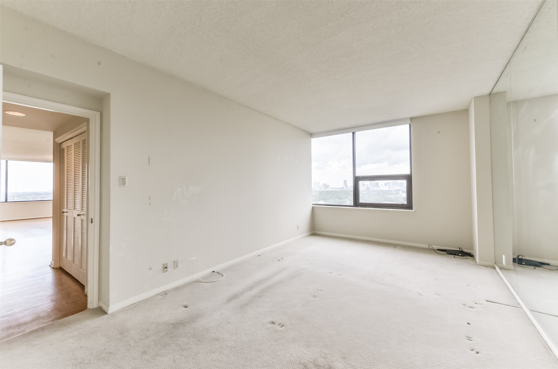 The large primary bedroom enjoys the Galleria skyline views. - If you have additional questions regarding 14 Greenway Plaza  in Houston or would like to tour the property with us call 800-660-1022 and reference MLS# 26451519.