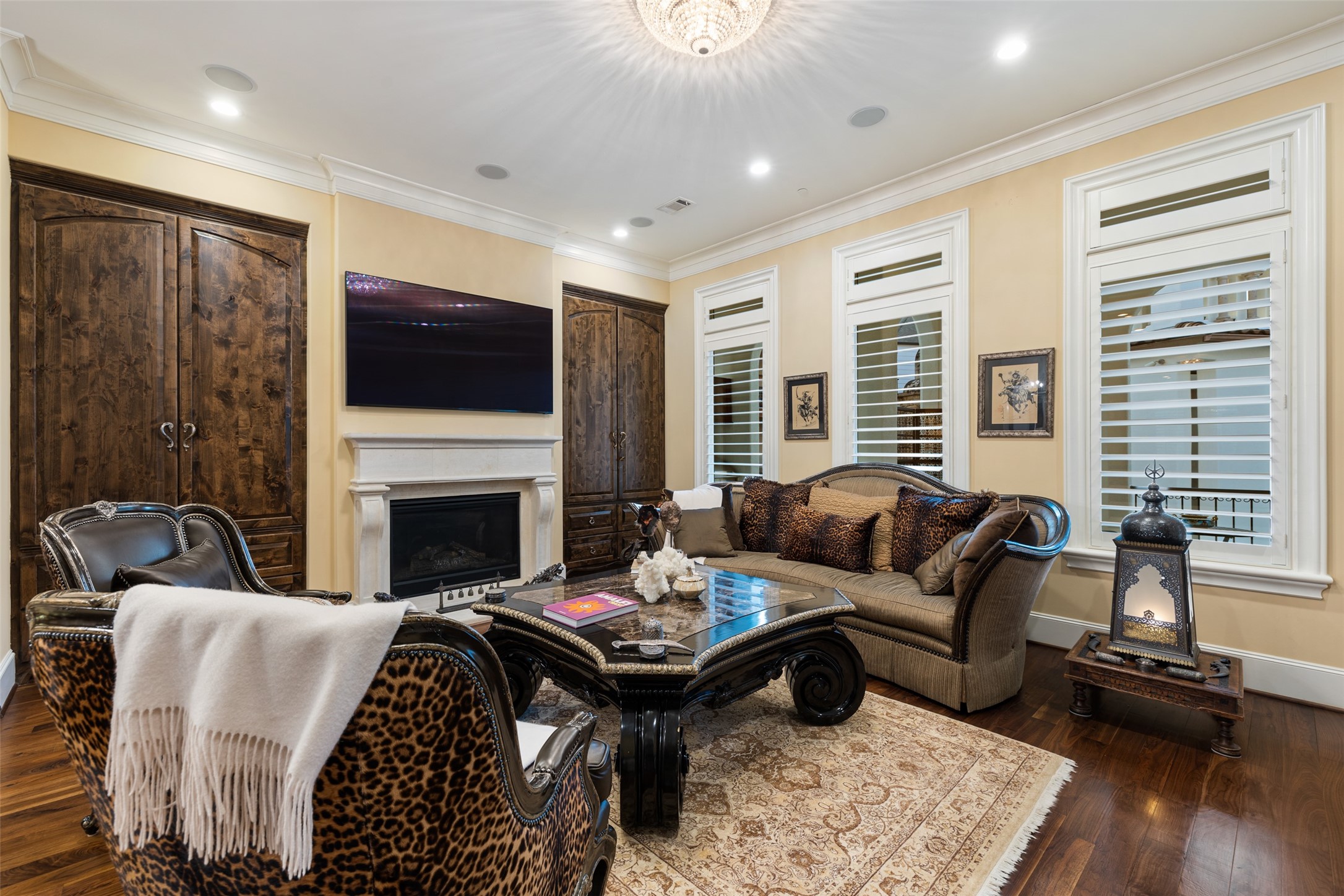 The spacious living area is surrounded by a fireplace, large windows and access to a wide balcony with a built-in grill - If you have additional questions regarding 5318 Paseo Caceres Drive  in Houston or would like to tour the property with us call 800-660-1022 and reference MLS# 10217676.