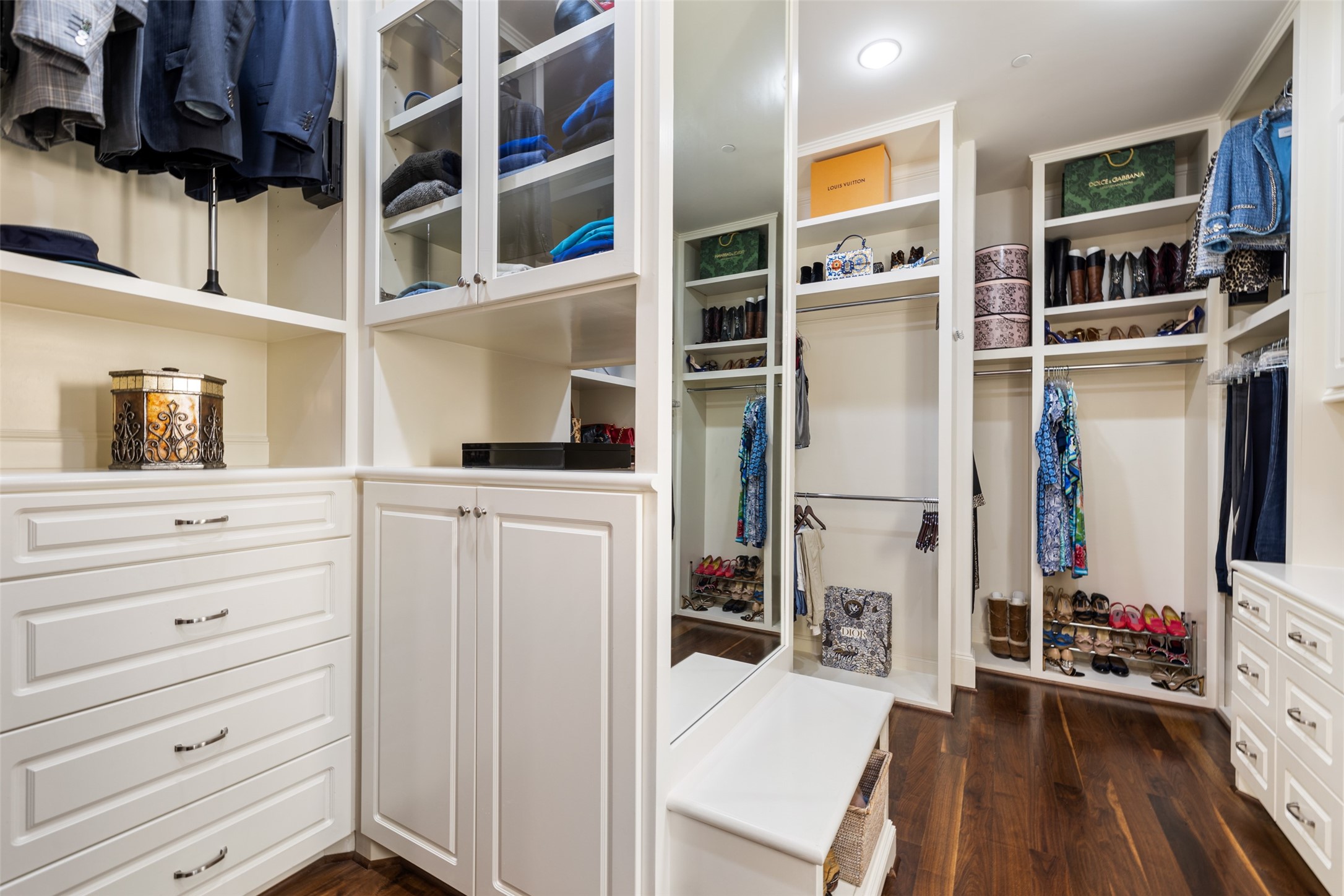 The enviable owner's closet is a fashionista's dream with abundant pull-down hanging rods, cabinetry and drawers - If you have additional questions regarding 5318 Paseo Caceres Drive  in Houston or would like to tour the property with us call 800-660-1022 and reference MLS# 10217676.
