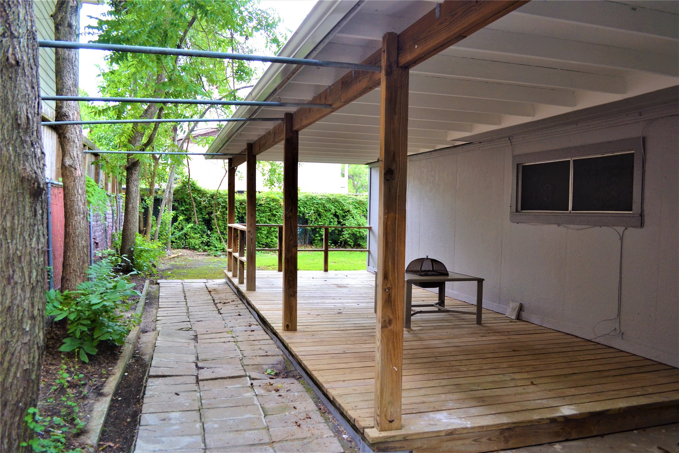 Outdoor, covered patio space for entertaining. - If you have additional questions regarding 9322 Olathe Street  in Houston or would like to tour the property with us call 800-660-1022 and reference MLS# 48770450.