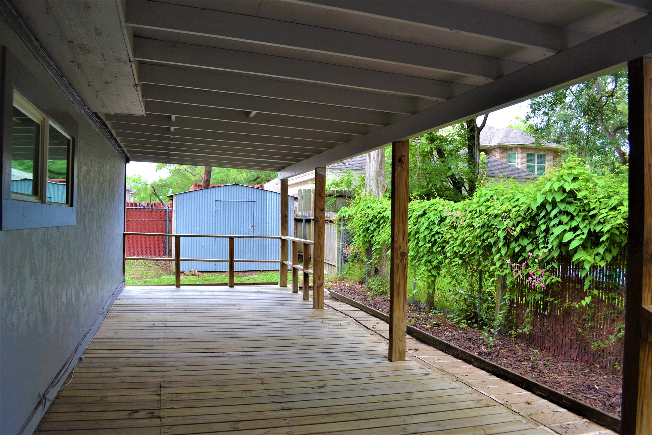 View of the covered, outside entertaining area. - If you have additional questions regarding 9322 Olathe Street  in Houston or would like to tour the property with us call 800-660-1022 and reference MLS# 74942443.