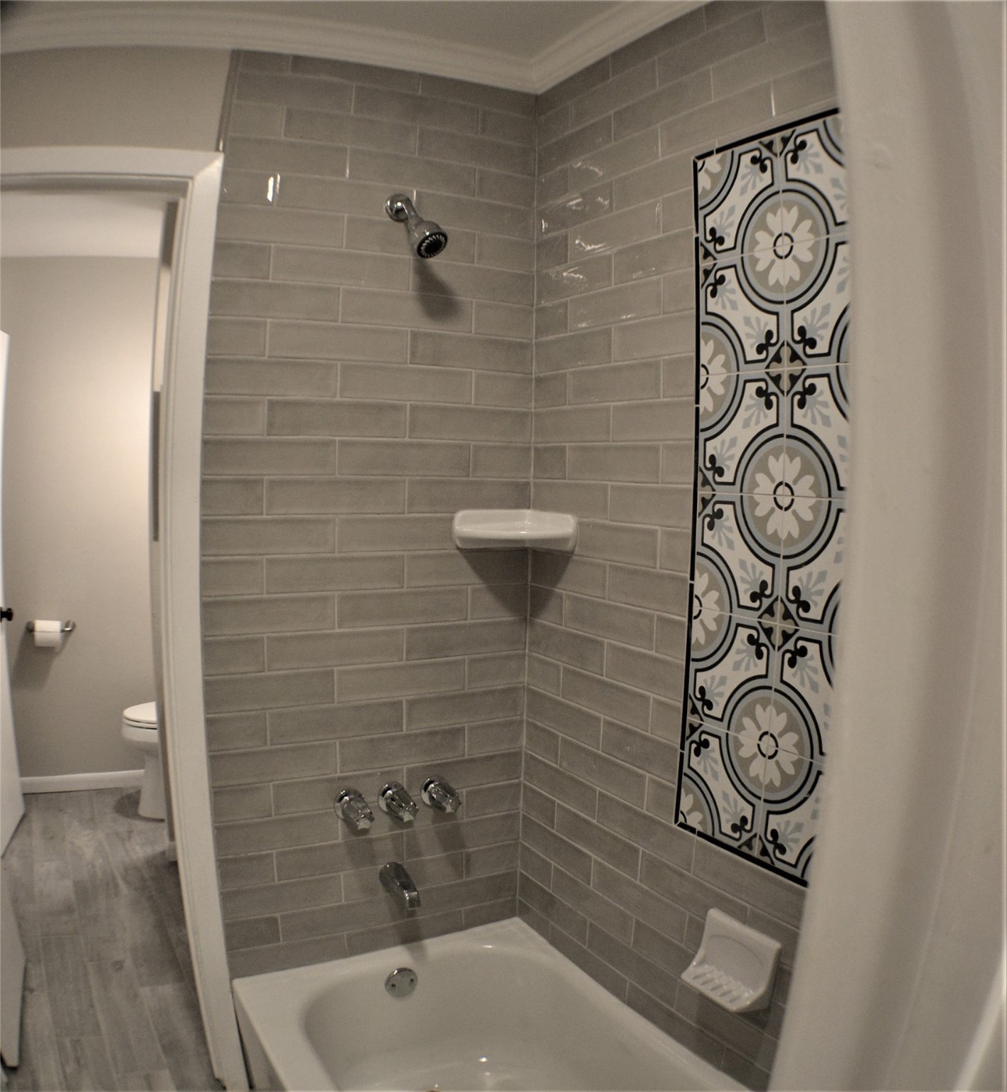Remodeled tub/shower with new tile surround. - If you have additional questions regarding 9322 Olathe Street  in Houston or would like to tour the property with us call 800-660-1022 and reference MLS# 74942443.