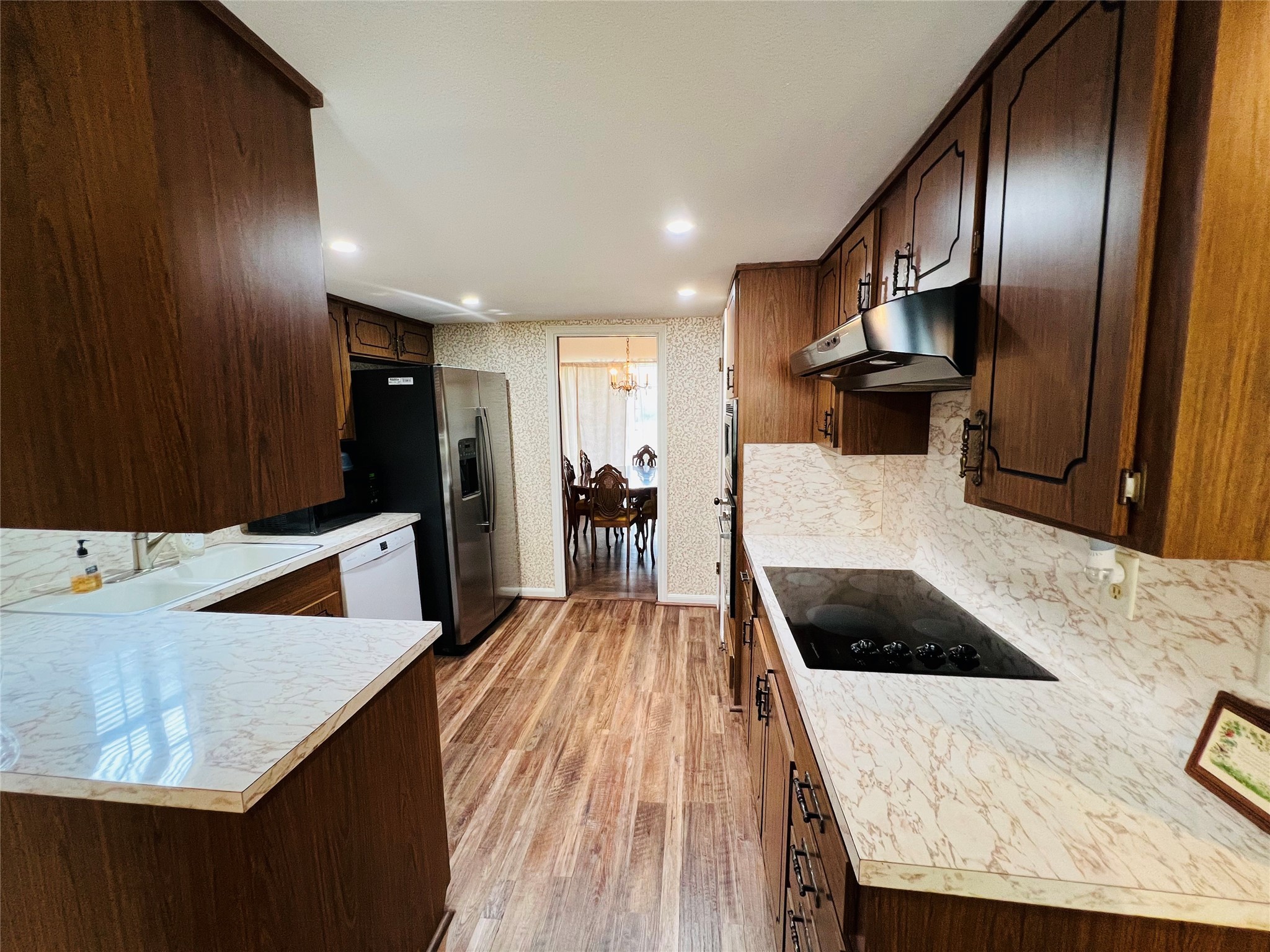 kitchen with new electric oven - If you have additional questions regarding 8503 Sharpcrest Street  in Houston or would like to tour the property with us call 800-660-1022 and reference MLS# 77150431.