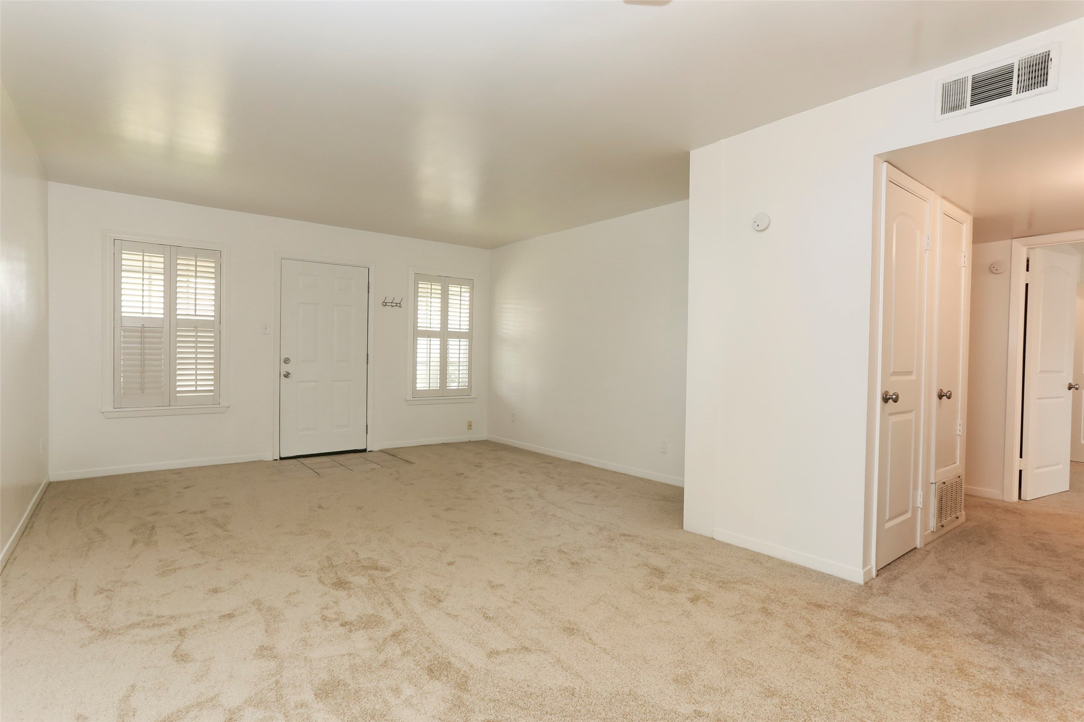 Standing look toward the front door.  Hall to bedrooms and hall bath to the right.  Kitchen is behind you in this photo. - If you have additional questions regarding 9017 Gaylord Drive  in Houston or would like to tour the property with us call 800-660-1022 and reference MLS# 73330240.