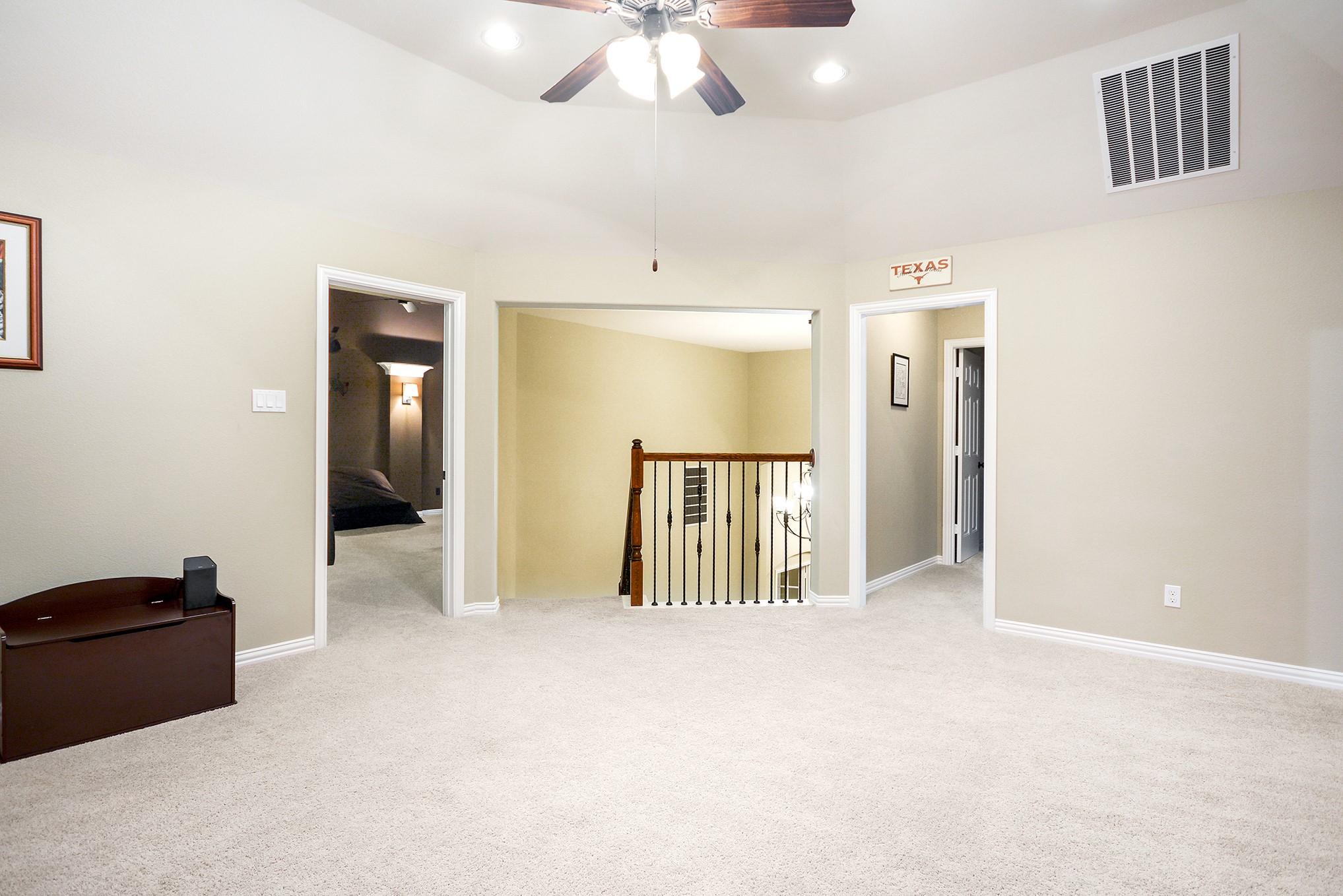 View from the game room toward the staircase and media room - If you have additional questions regarding 27827 Walsh Crossing Drive  in Katy or would like to tour the property with us call 800-660-1022 and reference MLS# 49318095.