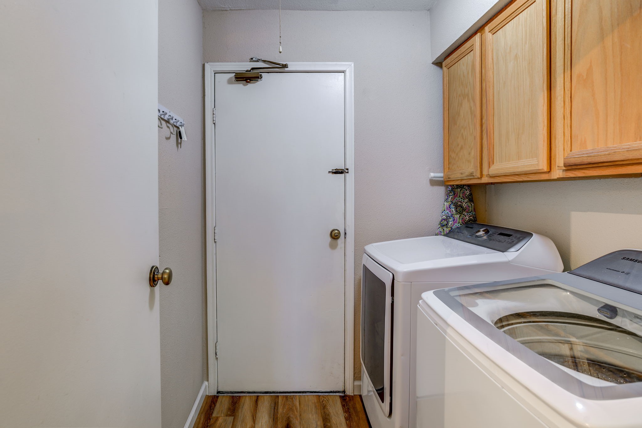 Laundry room with easy access to garage - If you have additional questions regarding 15446 Peermont Street  in Houston or would like to tour the property with us call 800-660-1022 and reference MLS# 86166354.