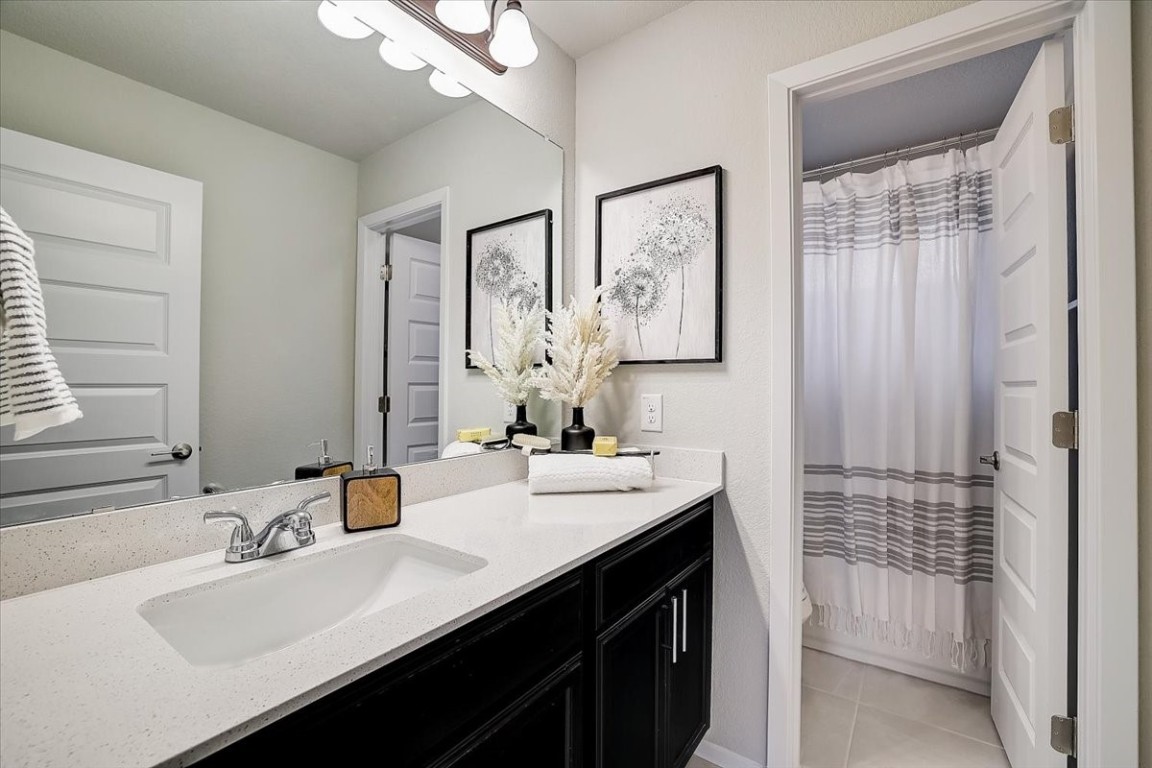 Guest full bath: Guests will love the stylish and spacious full bathroom, complete with modern fixtures and plenty of storage. - If you have additional questions regarding 5629 Respinto Drive  in Austin or would like to tour the property with us call 800-660-1022 and reference MLS# 8807124.