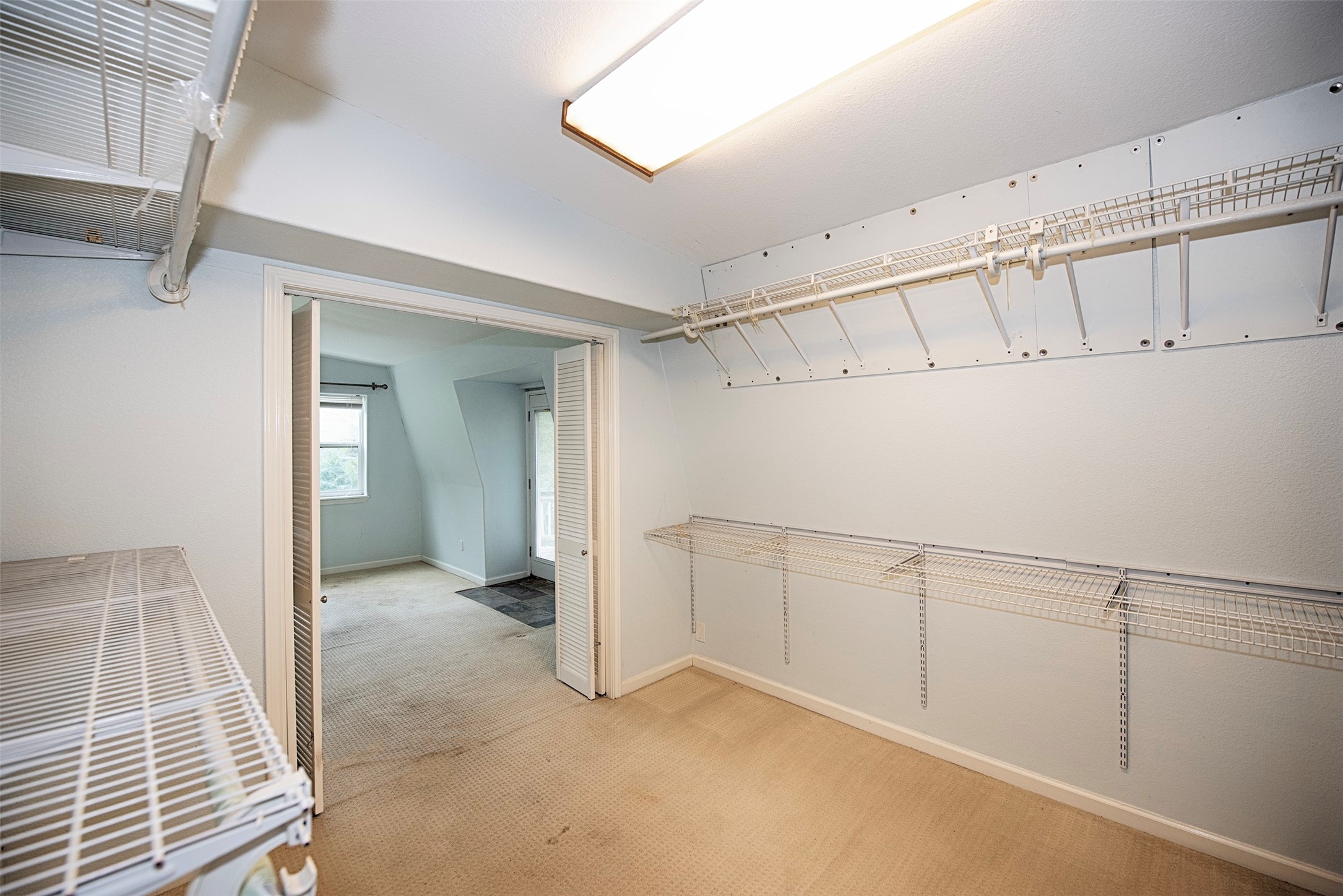 A view of the closet space with sliding doors the primary bedroom. - If you have additional questions regarding 1028 N Country Club Drive  in Shoreacres or would like to tour the property with us call 800-660-1022 and reference MLS# 5487846.