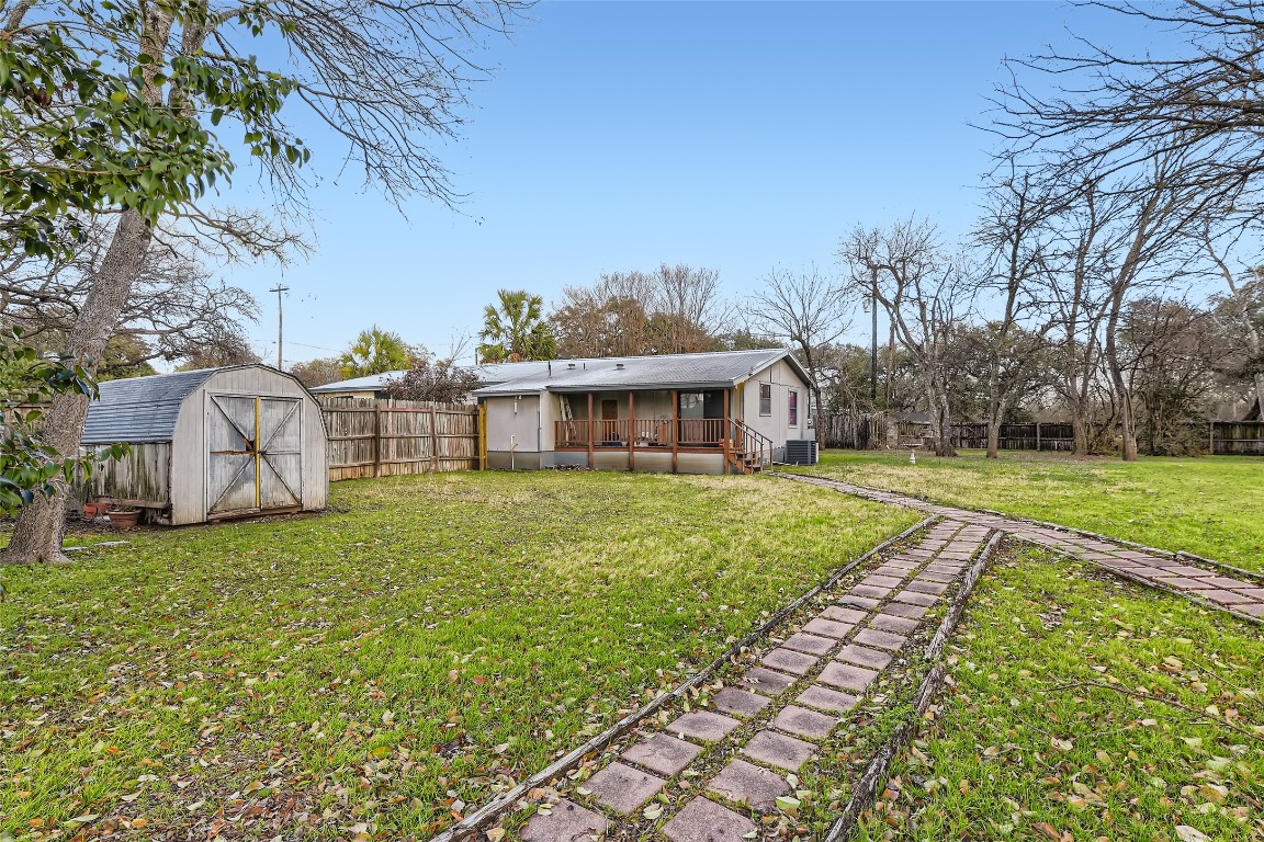 Path from parking at the rear along with storage area - If you have additional questions regarding 915 W F M Road 1626  in Manchaca or would like to tour the property with us call 800-660-1022 and reference MLS# 6678882.