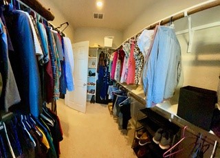 Master Closet - If you have additional questions regarding 1210 Nicholas Manor  in San Antonio or would like to tour the property with us call 800-660-1022 and reference MLS# 2389638.