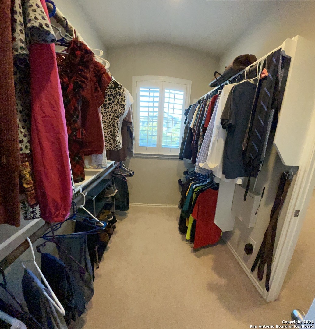 Master Closet - If you have additional questions regarding 1210 Nicholas Manor  in San Antonio or would like to tour the property with us call 800-660-1022 and reference MLS# 2389638.