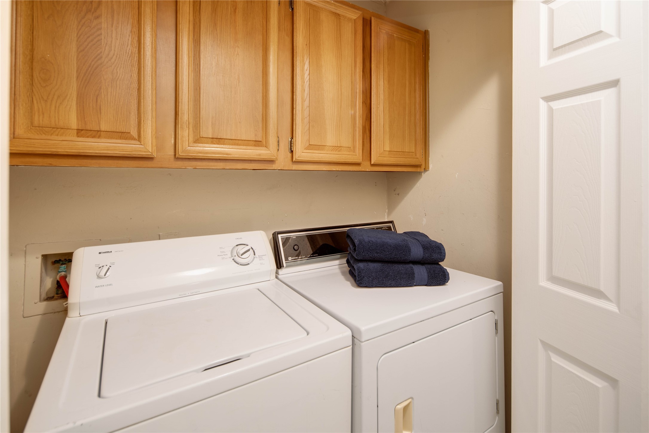 Laundry closet with storage - If you have additional questions regarding 2835 Oakside Drive  in Bryan or would like to tour the property with us call 800-660-1022 and reference MLS# 38572652.
