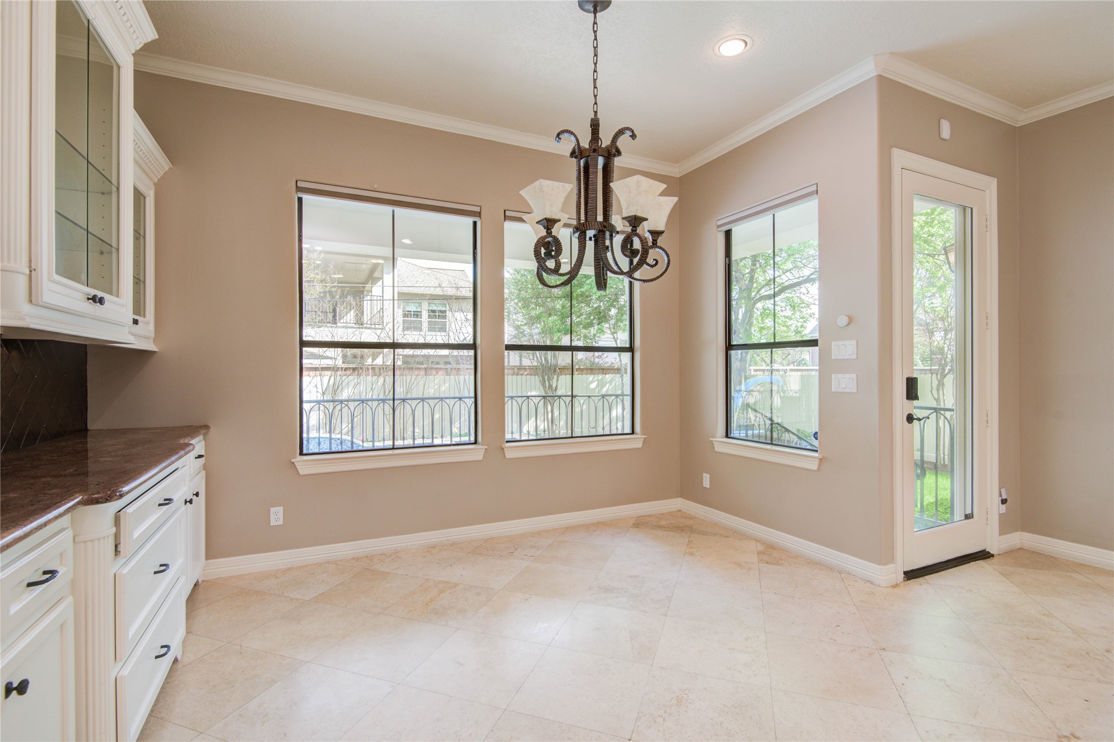 Sunny breakfast room overlooks the covered patio and pool - If you have additional questions regarding 4602 Holt Street  in Bellaire or would like to tour the property with us call 800-660-1022 and reference MLS# 95627903.