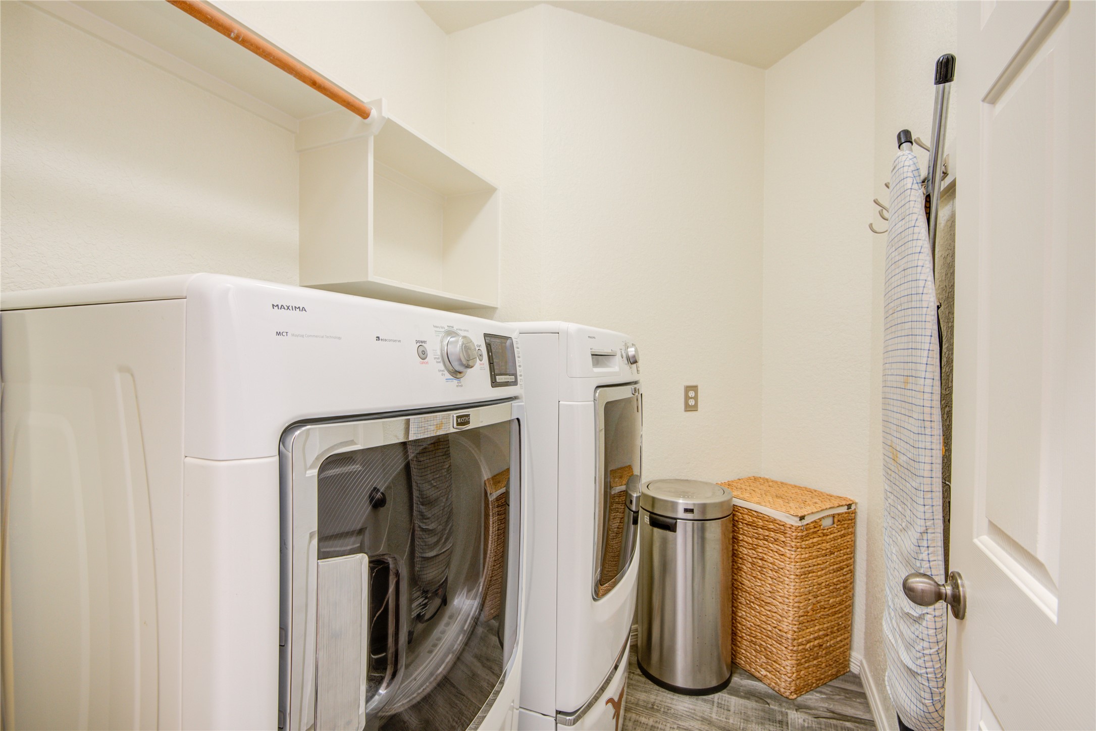 Laundry room with built-in shelving and located on the first​​‌​​​​‌​​‌‌​​​‌​‌​​​​‌​​‌​​​‌​‌​​‌‌‌​​​ floor - If you have additional questions regarding 1111 Chelshurst Way  in Spring or would like to tour the property with us call 800-660-1022 and reference MLS# 54717444.