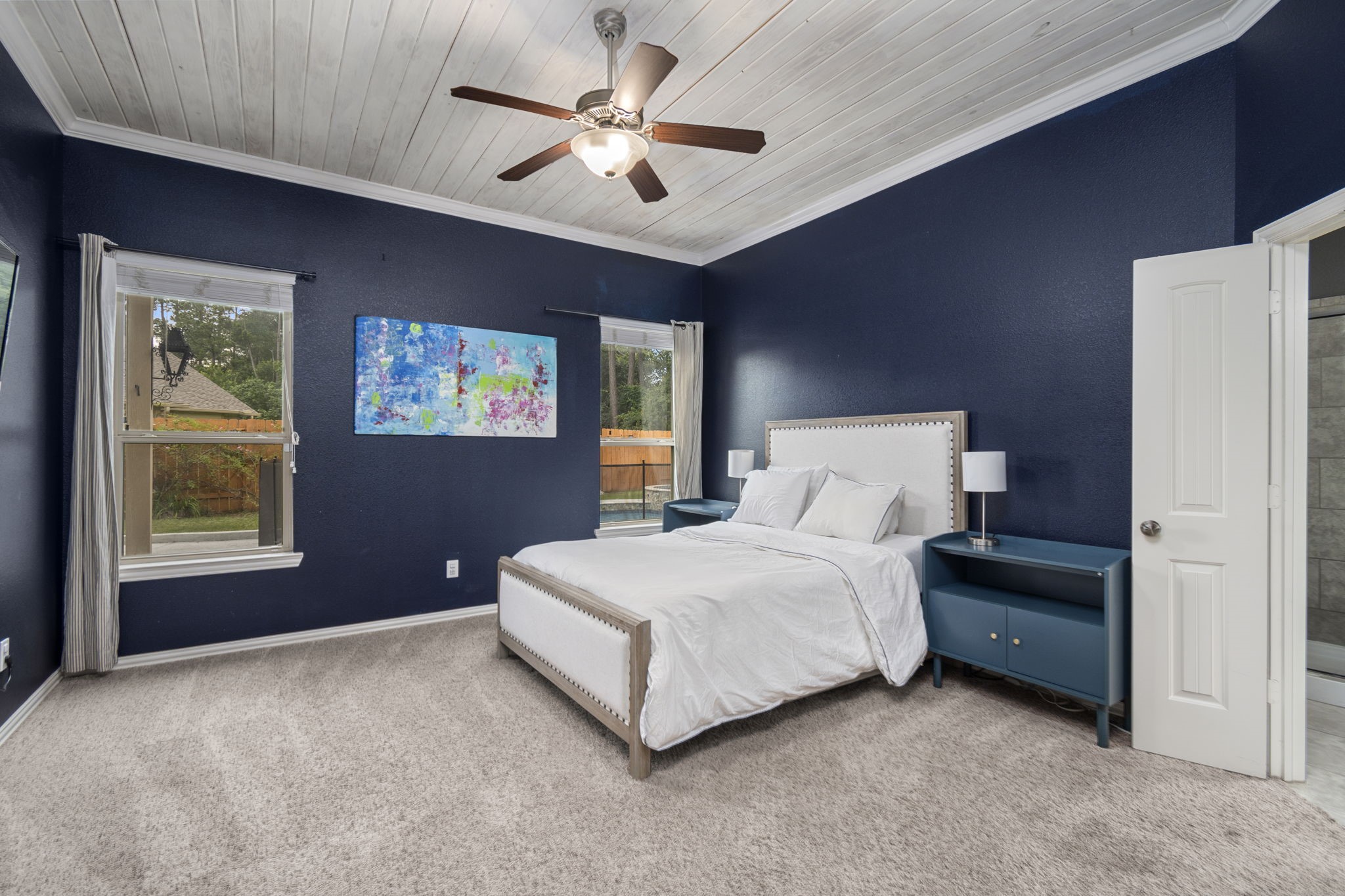 Primary Bedroom with Huge Windows looking into Back-Yard with Pool - If you have additional questions regarding 7423 Simpson Springs Lane  in Spring or would like to tour the property with us call 800-660-1022 and reference MLS# 15164487.