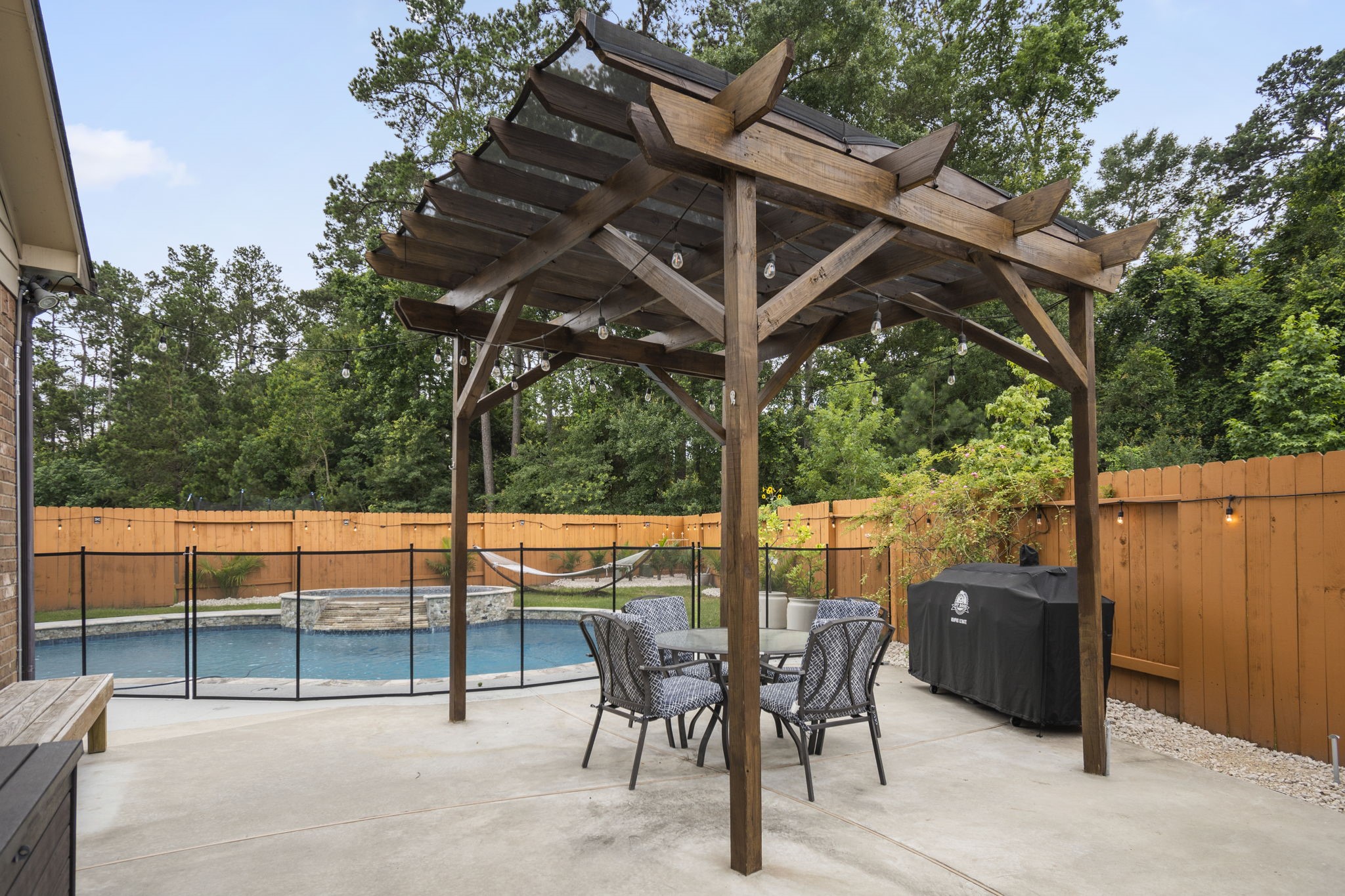 Right side of Back-Yard with Pergola overlooking Pool - If you have additional questions regarding 7423 Simpson Springs Lane  in Spring or would like to tour the property with us call 800-660-1022 and reference MLS# 15164487.