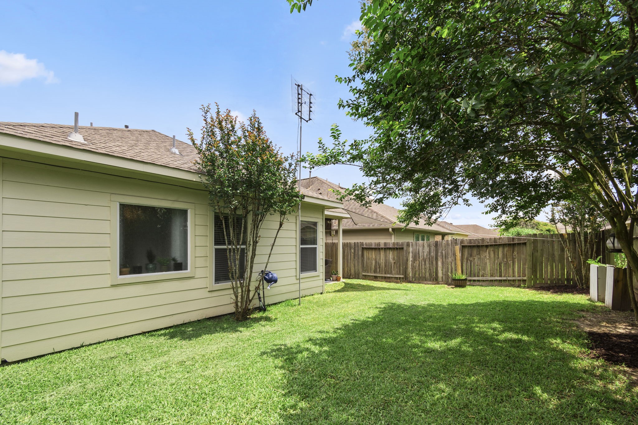 Covered porch with ceiling fan. - If you have additional questions regarding 27523 Gatlin Lane  in Spring or would like to tour the property with us call 800-660-1022 and reference MLS# 22577904.