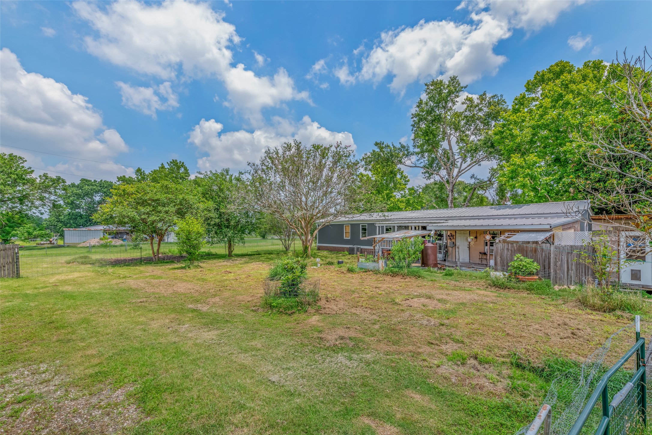 VIEW OF BACKYARD - If you have additional questions regarding 2055 Green Meadows Drive  in Sealy or would like to tour the property with us call 800-660-1022 and reference MLS# 16848431.