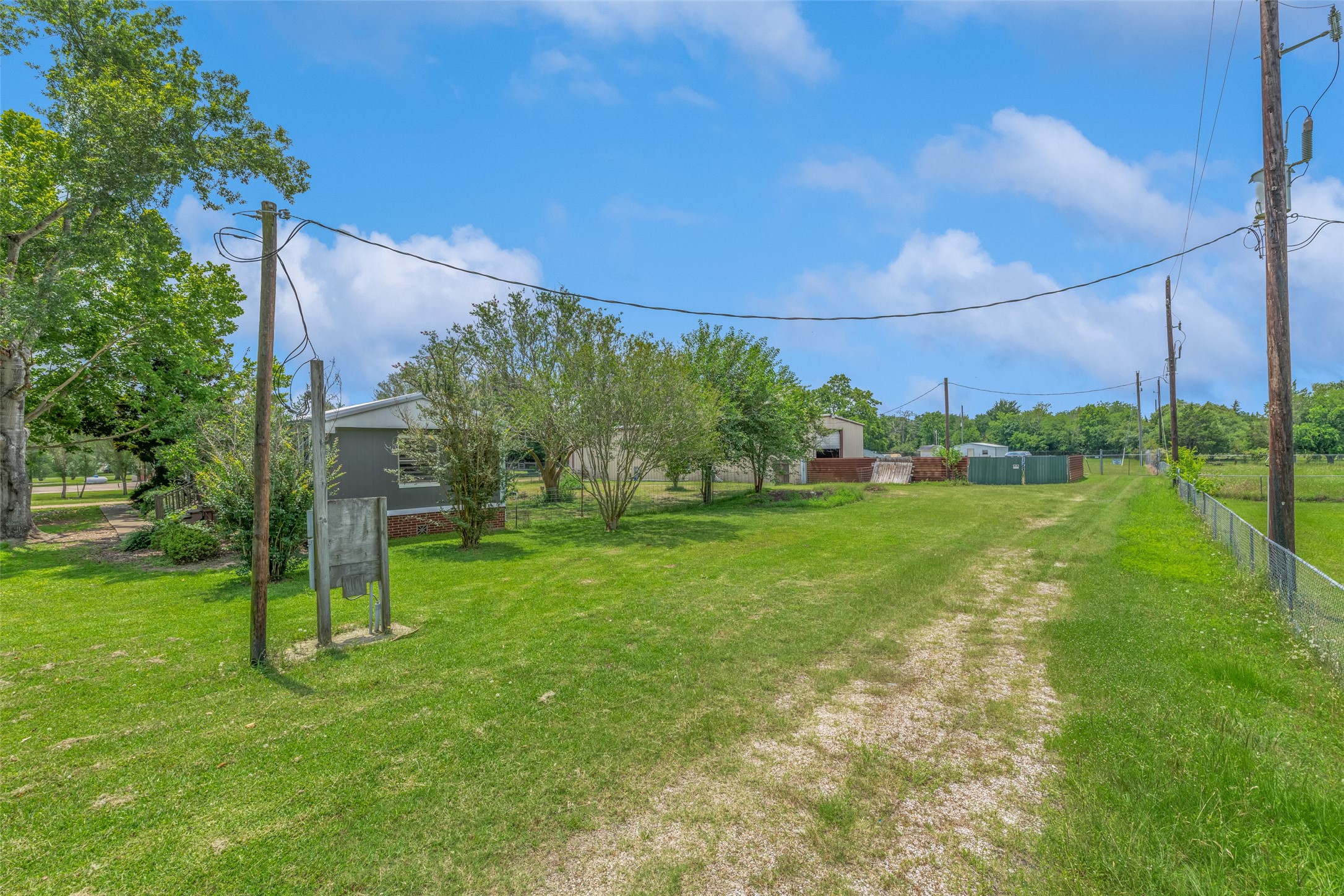 RIGHT SIDE OF PROPERTY, EASEMENT TO WATER COMPANY - If you have additional questions regarding 2055 Green Meadows Drive  in Sealy or would like to tour the property with us call 800-660-1022 and reference MLS# 16848431.
