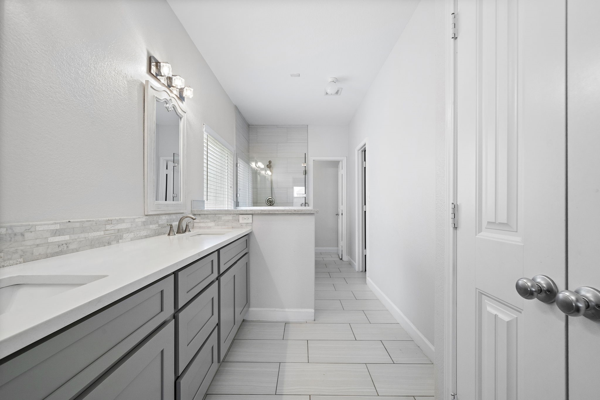 The primary bathroom in this home is thoughtfully designed with ample storage options, ensuring a clutter-free and organized space for all your personal essentials. - If you have additional questions regarding 8307 Egret Bay Circle  in Baytown or would like to tour the property with us call 800-660-1022 and reference MLS# 61311135.