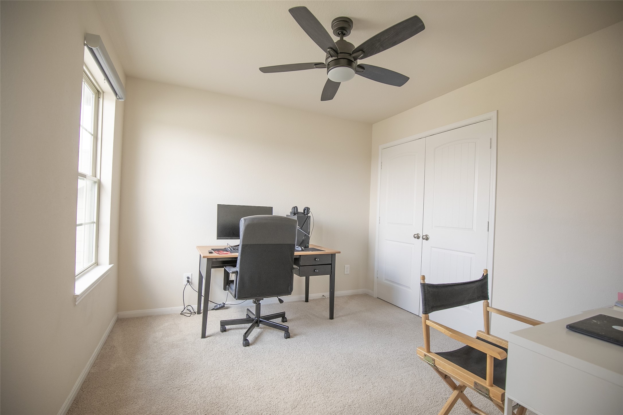 2nd bedroom with ceiling fan and a remote for easy cooling - If you have additional questions regarding 2835 Meandering Elm Trail  in Houston or would like to tour the property with us call 800-660-1022 and reference MLS# 93640209.