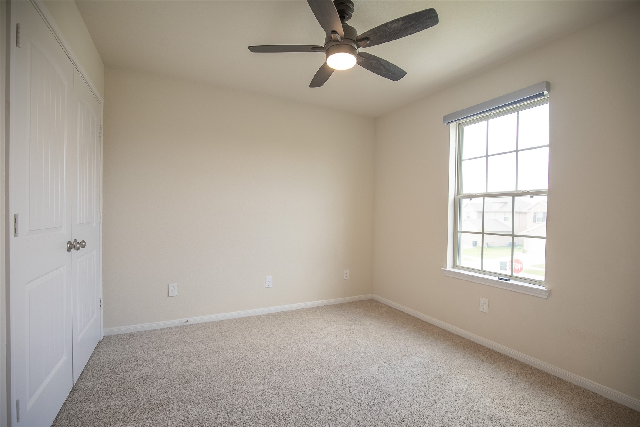 Third bedroom with a ceiling fan and a remote for easy cooling. - If you have additional questions regarding 2835 Meandering Elm Trail  in Houston or would like to tour the property with us call 800-660-1022 and reference MLS# 93640209.
