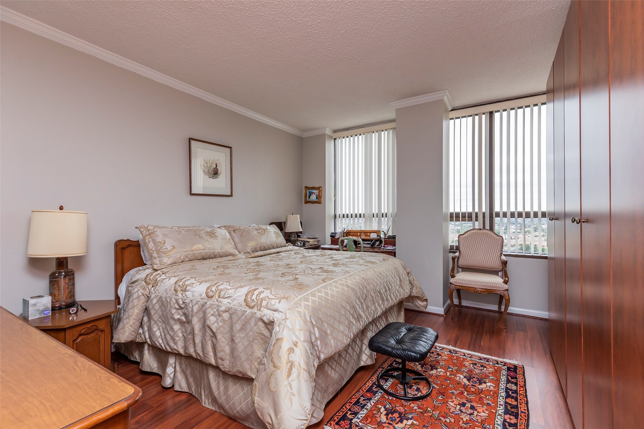 Master bedroom with engineered hardwood floors and custom built-in storage. - If you have additional questions regarding 5150 Hidalgo Street  in Houston or would like to tour the property with us call 800-660-1022 and reference MLS# 38943512.