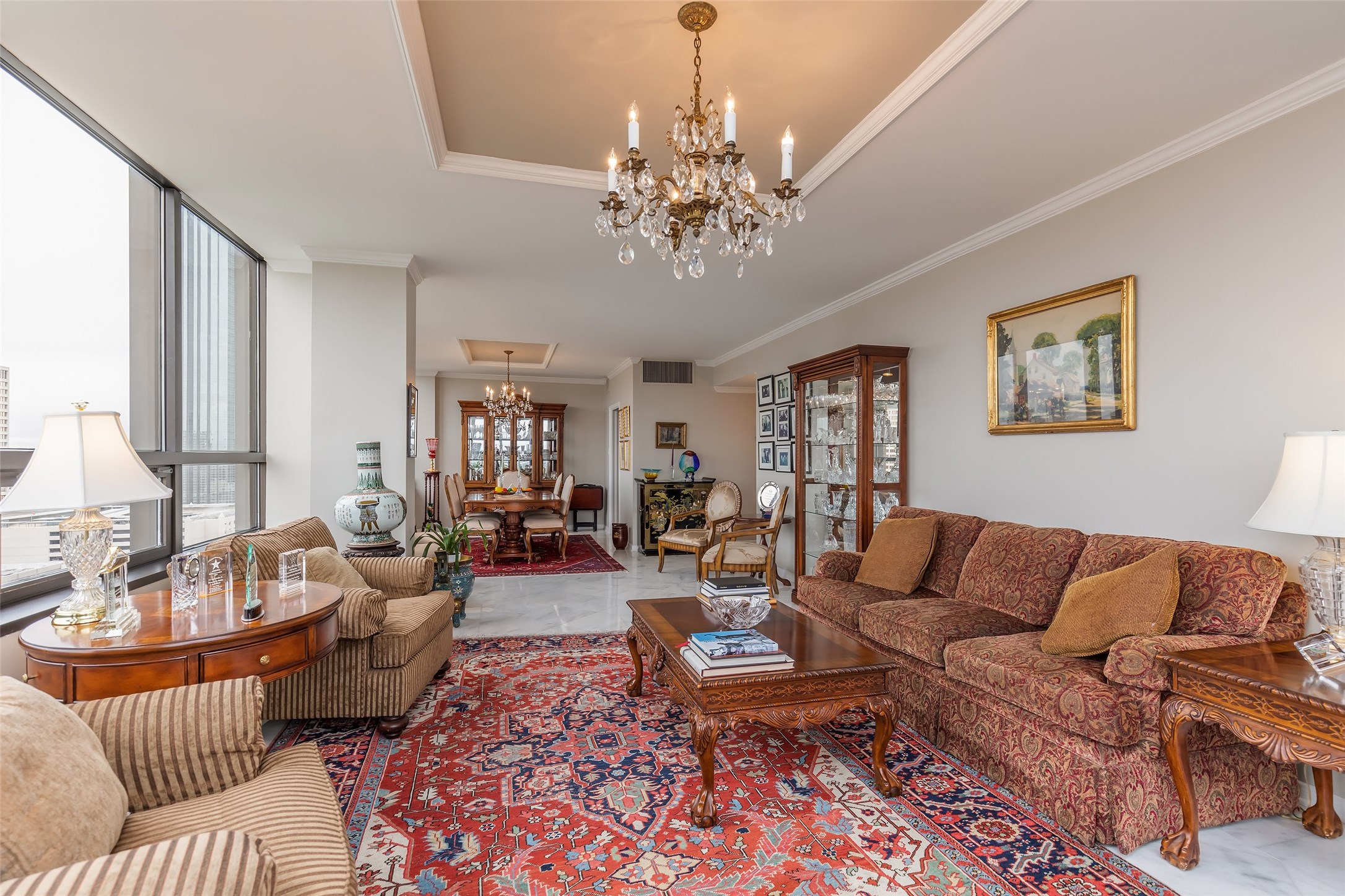 Another view of the open living and dining area.  Elegant marble floors and recessed ceilings. - If you have additional questions regarding 5150 Hidalgo Street  in Houston or would like to tour the property with us call 800-660-1022 and reference MLS# 38943512.