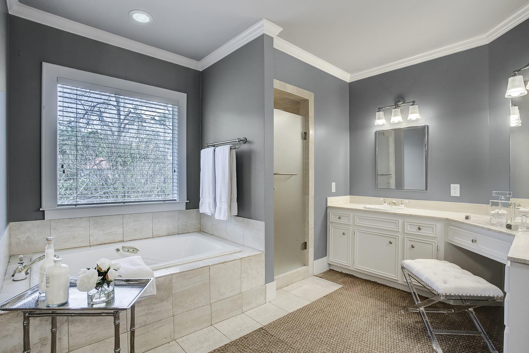Master Bathroom with separate double vanity areas, makeup vanity, and storage galore! - If you have additional questions regarding 1802 North Boulevard  in Houston or would like to tour the property with us call 800-660-1022 and reference MLS# 16203839.
