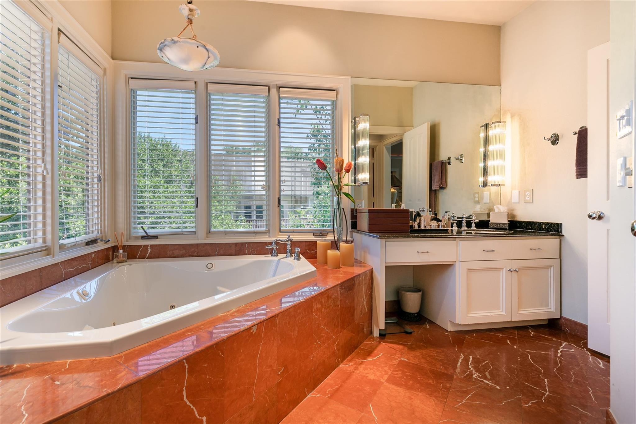 Master bathroom filled with natural light and oversized bathtub. - If you have additional questions regarding 3814 Purdue Street  in Houston or would like to tour the property with us call 800-660-1022 and reference MLS# 32310789.