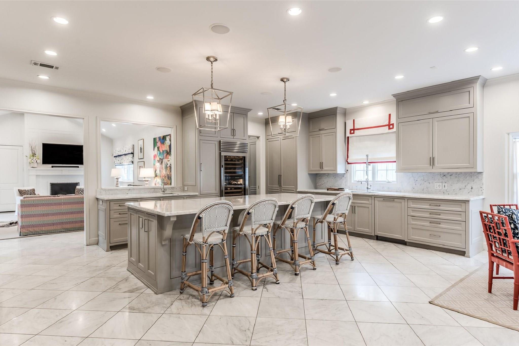[Kitchen 24x16] The open gathering kitchen is equipped with professional-grade SubZero and Wolf appliances. - If you have additional questions regarding 6002 Green Tree Road  in Houston or would like to tour the property with us call 800-660-1022 and reference MLS# 5490976.