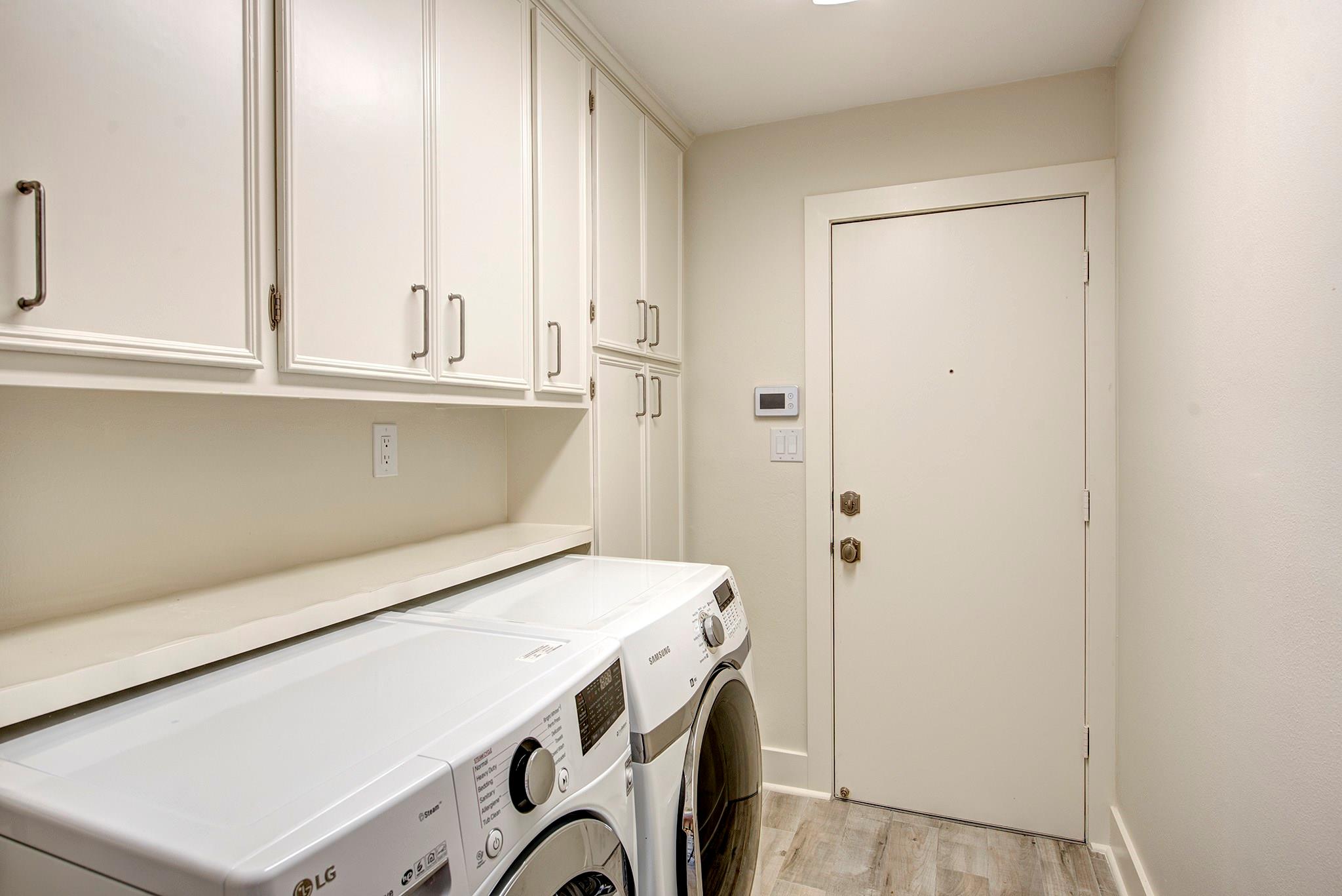Utility room off Kitchen with wonderful storage! - If you have additional questions regarding 12326 Tunbridge Lane  in Houston or would like to tour the property with us call 800-660-1022 and reference MLS# 30688628.