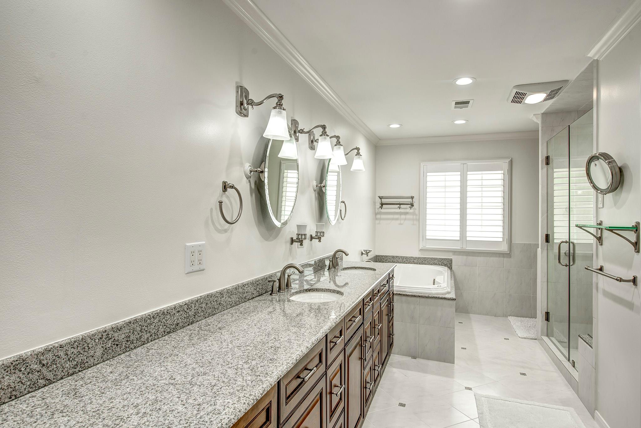 Elegant mater bathroom with abundant drawers, granite counter, two sinks, large shower with glass surround and soaking tub. Don't miss the two custom fitted closets!!&#xA; - If you have additional questions regarding 12326 Tunbridge Lane  in Houston or would like to tour the property with us call 800-660-1022 and reference MLS# 30688628.