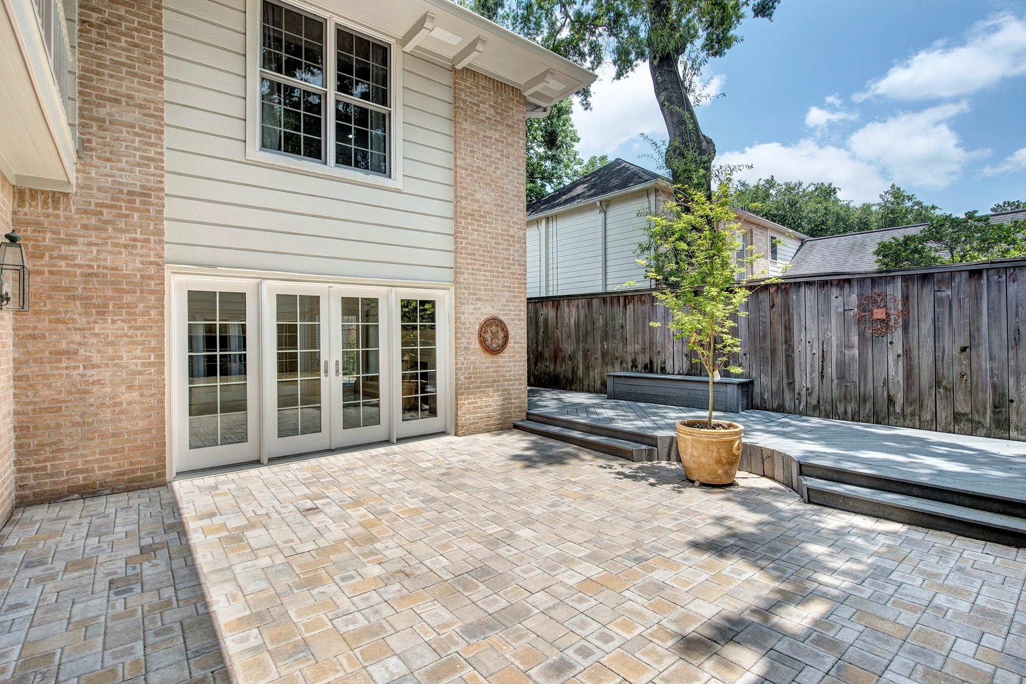 Alternate view of the courtyard and elevated deck. - If you have additional questions regarding 12326 Tunbridge Lane  in Houston or would like to tour the property with us call 800-660-1022 and reference MLS# 30688628.