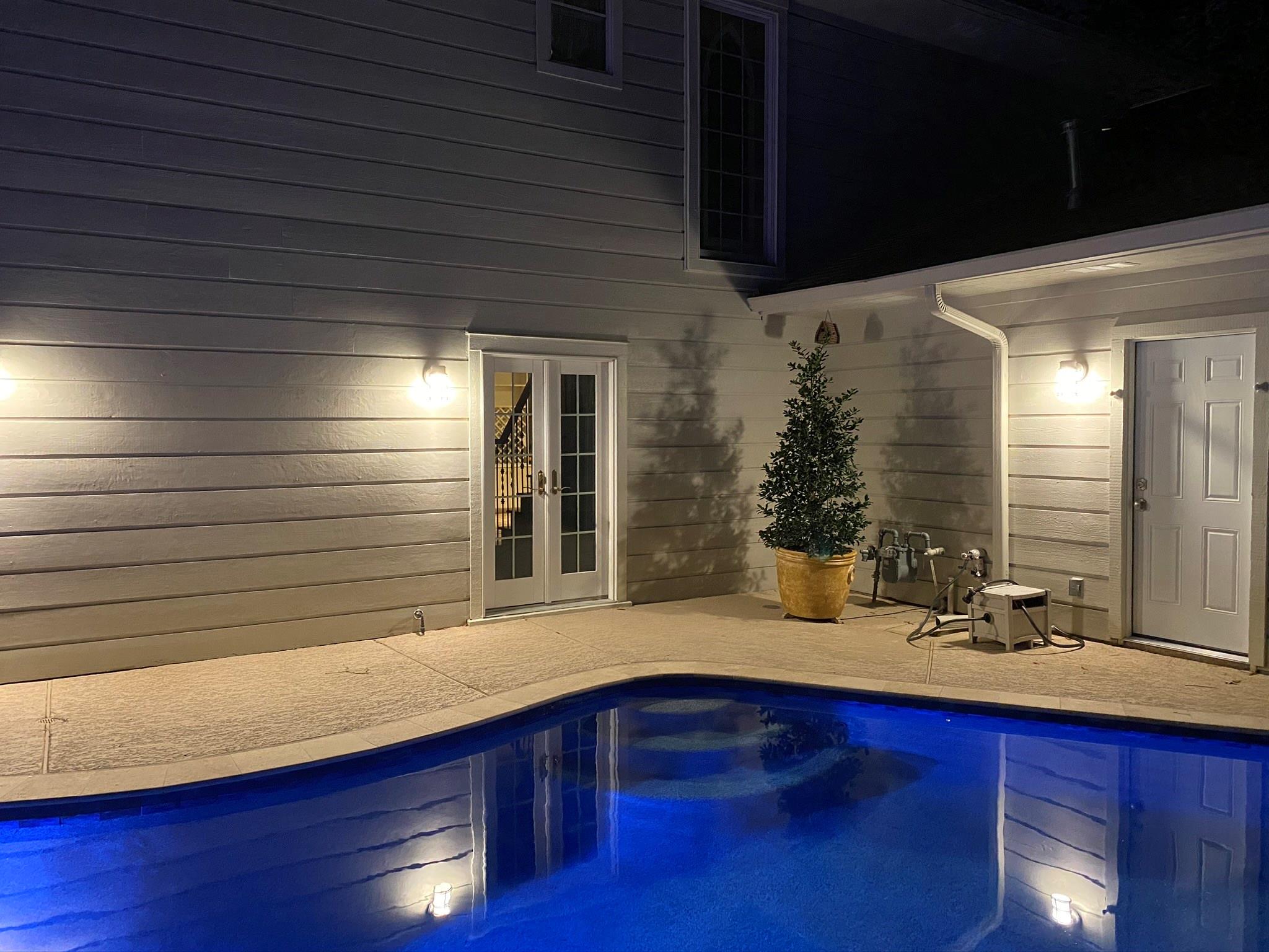 View of the pool showing how it is just breathtaking at night! - If you have additional questions regarding 12326 Tunbridge Lane  in Houston or would like to tour the property with us call 800-660-1022 and reference MLS# 30688628.