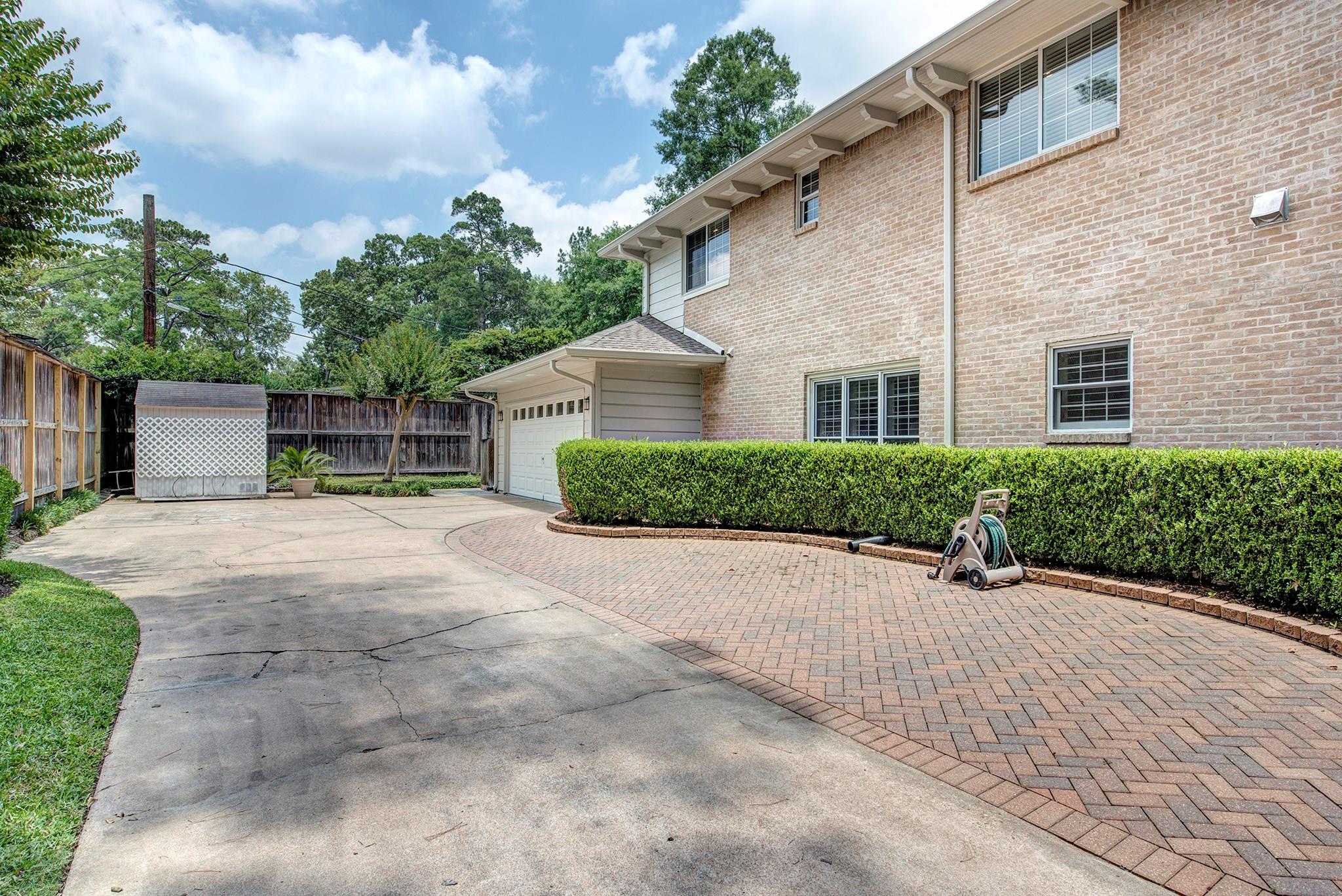 Driveway side with extra parking and automatic gate! - If you have additional questions regarding 12326 Tunbridge Lane  in Houston or would like to tour the property with us call 800-660-1022 and reference MLS# 30688628.