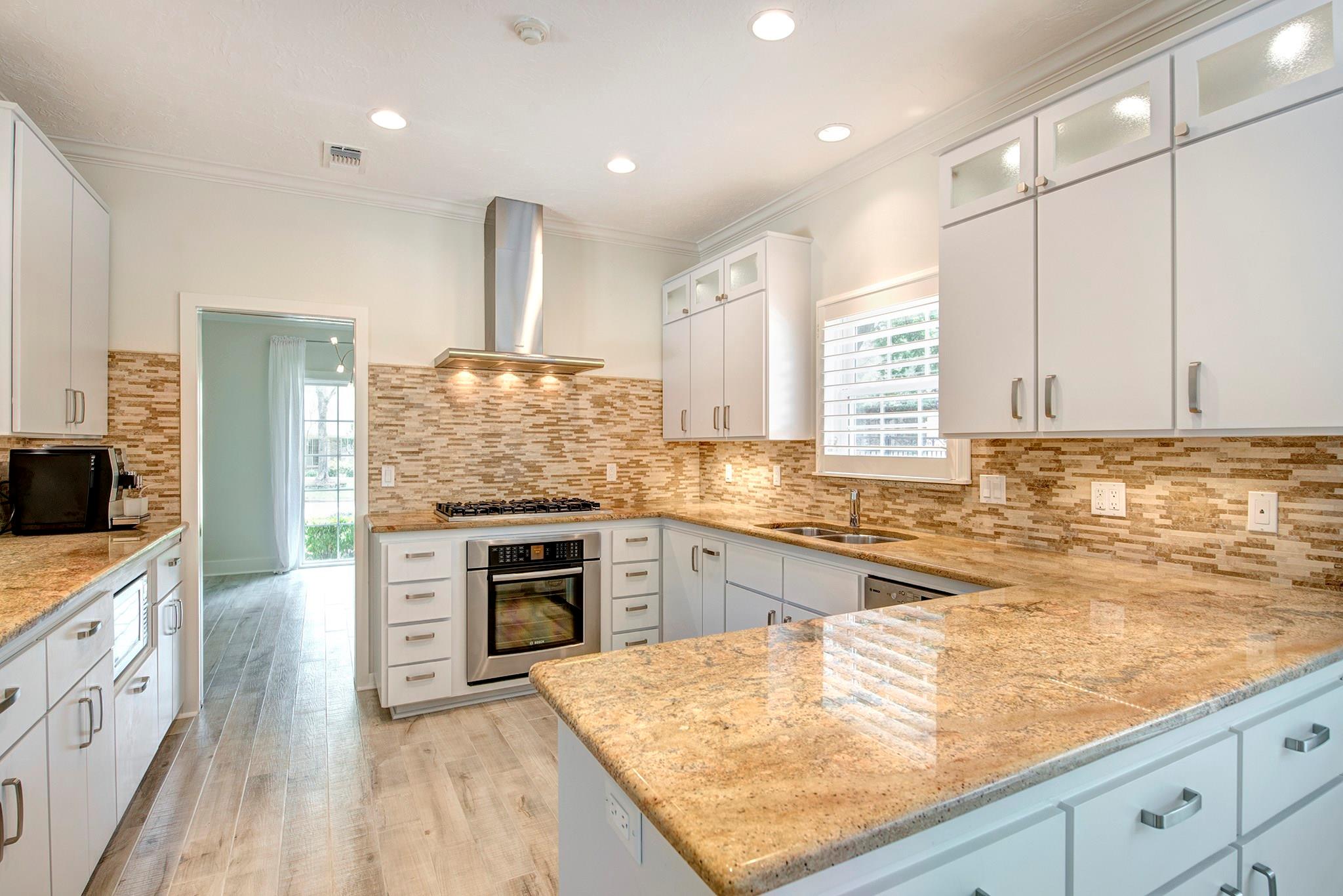 Light and bright kitchen with Bosch stove, oven and dishwasher, Viking gas range and Miele vent hood. - If you have additional questions regarding 12326 Tunbridge Lane  in Houston or would like to tour the property with us call 800-660-1022 and reference MLS# 30688628.