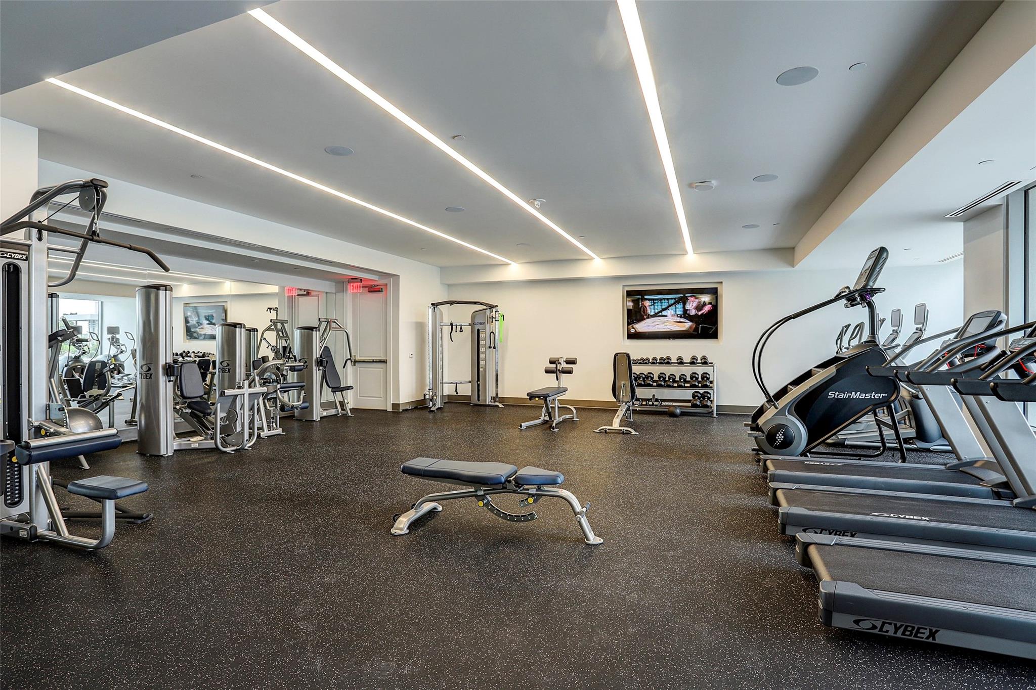 The fitness center located on the amenity deck has state-of-the-art equipment and offers views of the resort-like pool. - If you have additional questions regarding 2047 Westcreek Lane  in Houston or would like to tour the property with us call 800-660-1022 and reference MLS# 10209475.