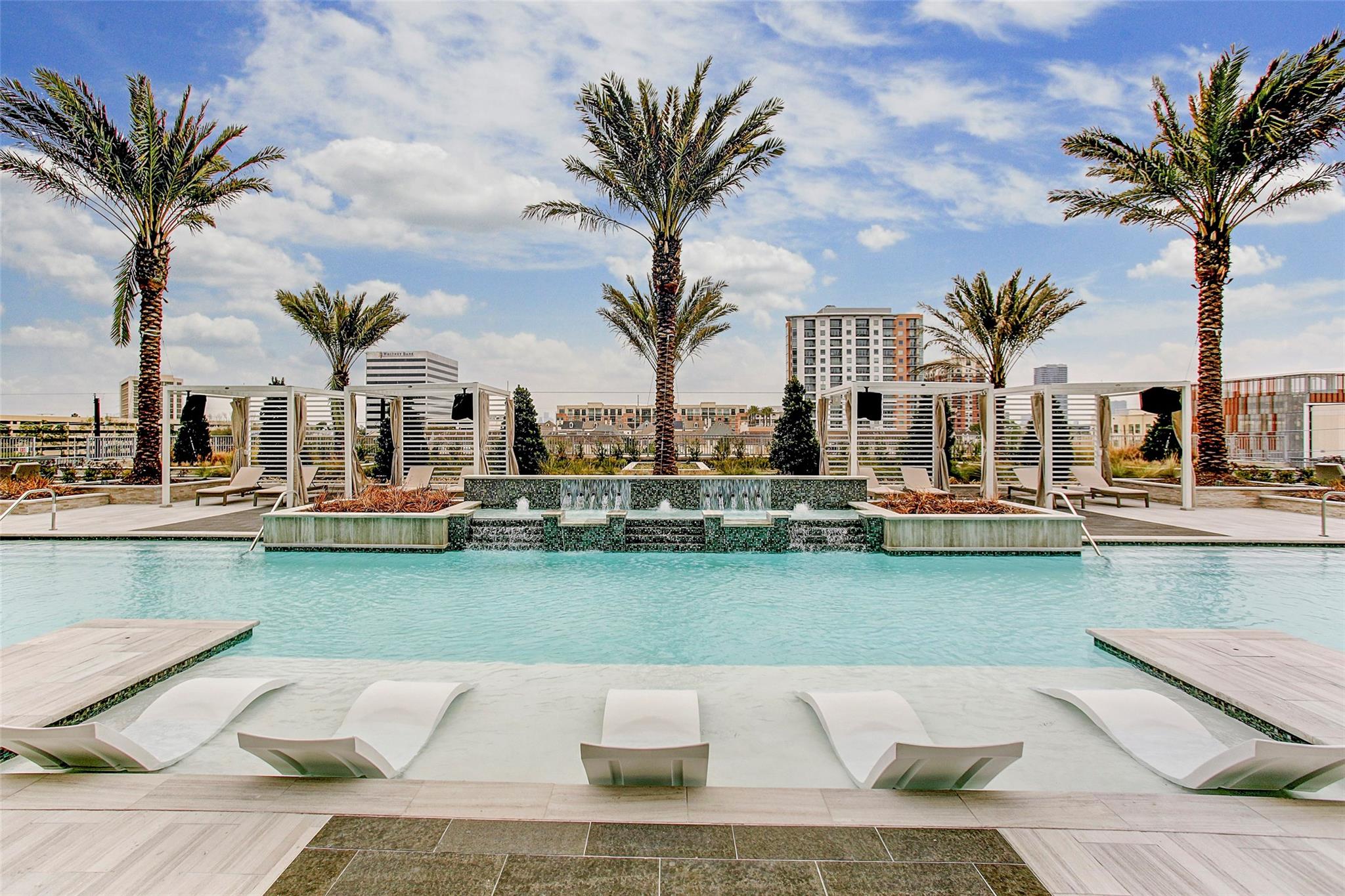 The pool deck is certainly impressive with covered cabanas, sunbathing areas, and exquisite water features. Palm trees and clear blue skies give the illusion that you are in a world-class resort. - If you have additional questions regarding 2047 Westcreek Lane  in Houston or would like to tour the property with us call 800-660-1022 and reference MLS# 10209475.
